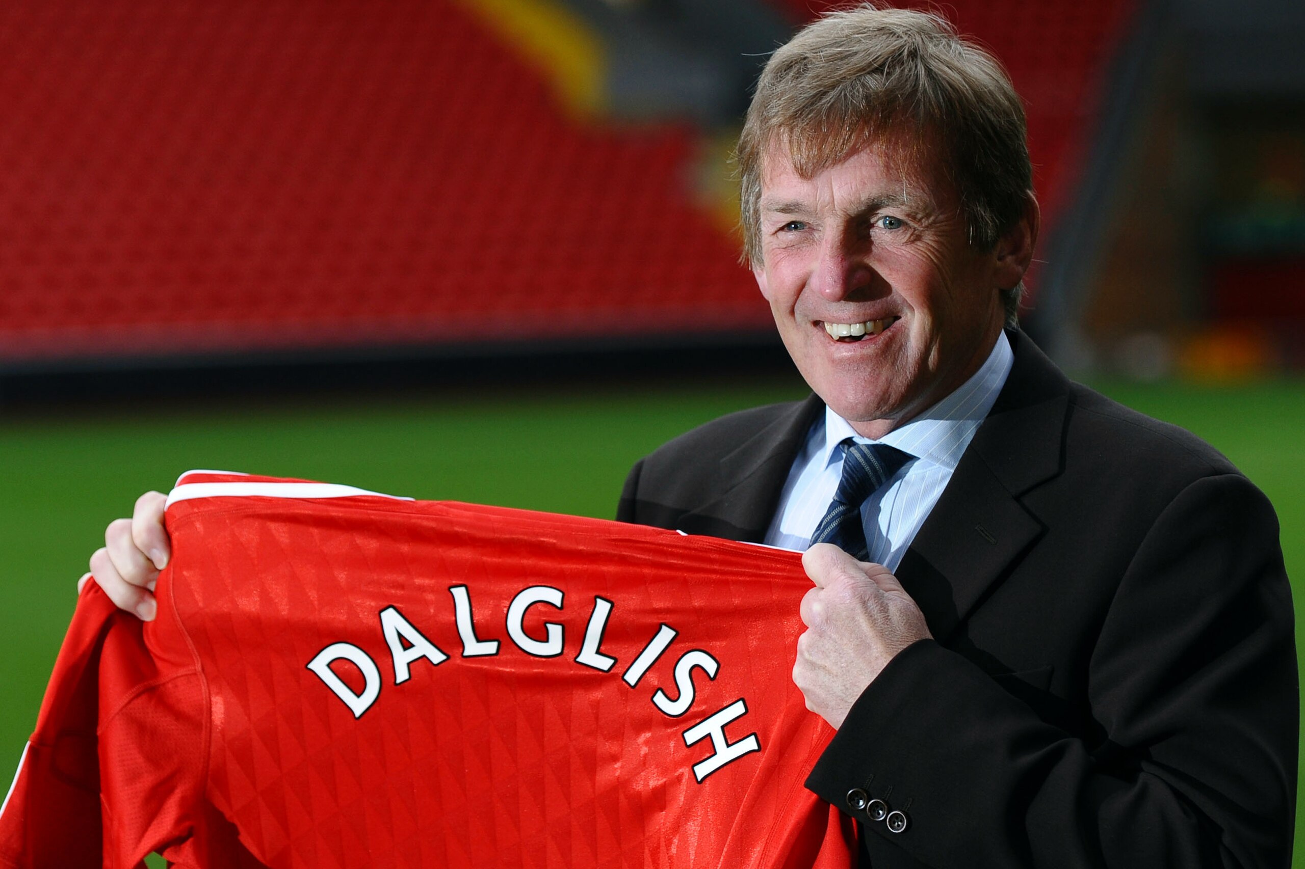 Liverpool Football Club's new manager Kenny Dalglish poses for photographers during a photocall at Anfield in Liverpool, north-west England, on January 10, 2011. Former Liverpool player and manager, Dalglish was manager at the club between 1985 and 1991 a
