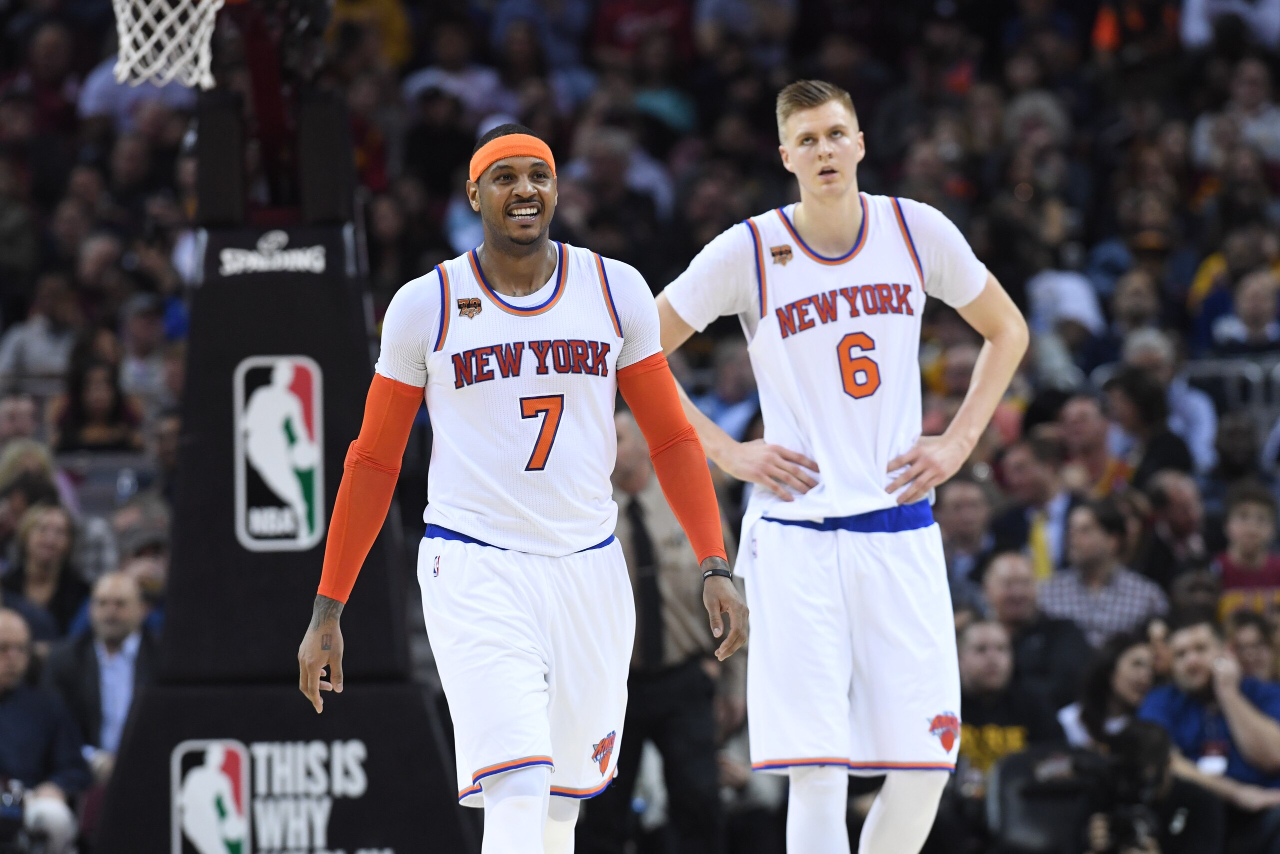 CLEVELAND, OH - FEBRUARY 23: Carmelo Anthony #7 and Kristaps Porzingis #6 of the New York Knicks walk off the court during a timeout during the first half against the Cleveland Cavaliers at Quicken Loans Arena on February 23, 2017 in Cleveland, Ohio. The 