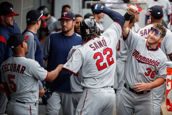 Apr 9, 2017; Chicago, IL, USA; Minnesota Twins third baseman Miguel Sano (22) celebrates with designated hitter Robbie Grossman (36) after hitting ta wo-run home run against the Chicago White Sox during the eighth inning at Guaranteed Rate Field. Mandator
