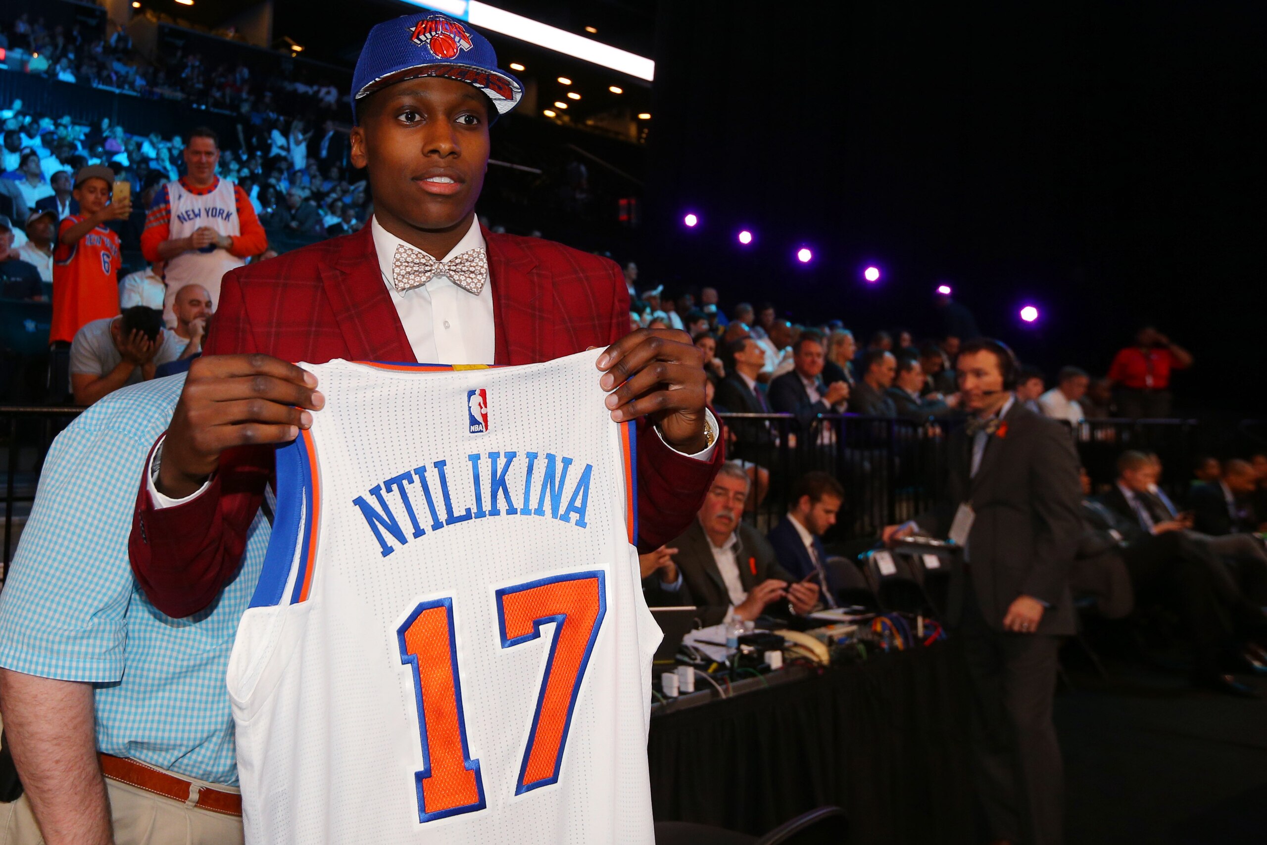 Jun 22, 2017; Brooklyn, NY, USA; Frank Ntilikina of France holds up a team jersey after being introduced as the number eight overall pick to the New York Knicks in the first round of the 2017 NBA Draft at Barclays Center. Mandatory Credit: Brad Penner-USA