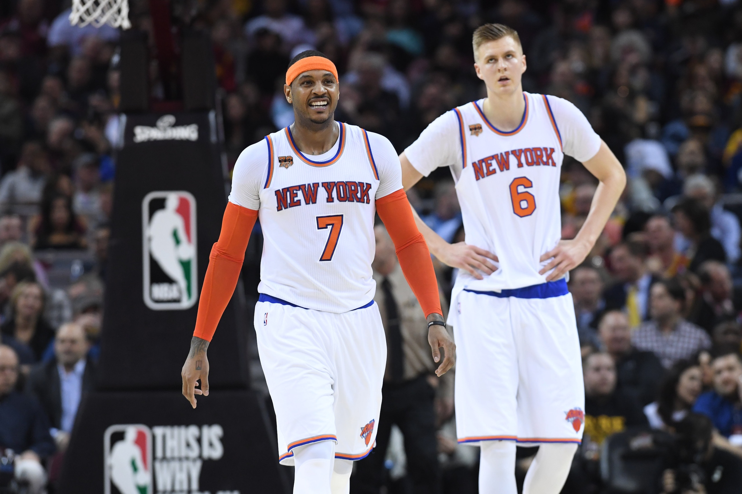 CLEVELAND, OH - FEBRUARY 23: Carmelo Anthony #7 and Kristaps Porzingis #6 of the New York Knicks walk off the court during a timeout during the first half against the Cleveland Cavaliers at Quicken Loans Arena on February 23, 2017 in Cleveland, Ohio. The 