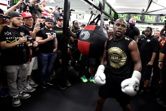 Boxer Floyd Mayweather Jr. strides before journalists during a media workout at the Mayweather Boxing Club August 10, 2017 in Las Vegas, Nevada. 
Mayweather is preparing to face MMA fighter Connor Mcgregor on August 26th at the T-Mobile Arena in Las Vegas