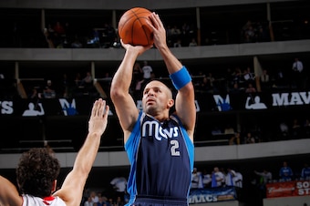 DALLAS, TX - DECEMBER 30: Jason Kidd #2 of the Dallas Mavericks shoots a jumper against Jose Calderon #8 of the Toronto Raptors on December 30, 2011 at the American Airlines Center in Dallas, Texas. NOTE TO USER: User expressly acknowledges and agrees tha