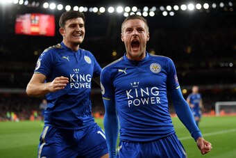 LONDON, ENGLAND - AUGUST 11:  Jamie Vardy (R) of Leicester City is congratulated by teammate Harry Maguire (L) after scoring his team's third goal during the Premier League match between Arsenal and Leicester City at the Emirates Stadium on August 11, 201