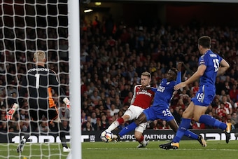 Arsenal's Welsh midfielder Aaron Ramsey (C) shoots to score Arsenal's third goal during the English Premier League football match between Arsenal and Leicester City at the Emirates Stadium in London on August 11, 2017.
Arsenal won the game 4-3. / AFP PHOT