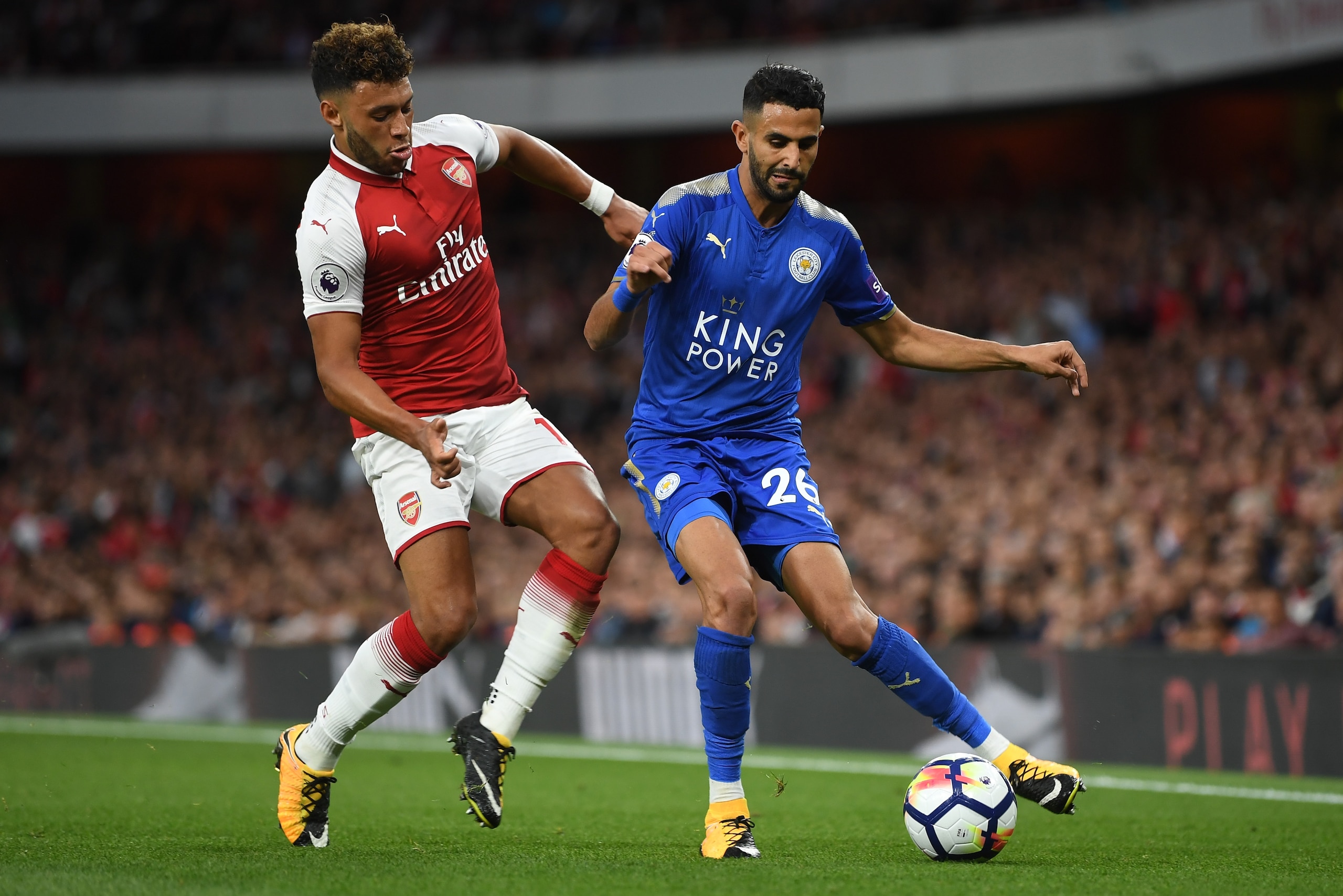 LONDON, ENGLAND - AUGUST 11:  Riyad Mahrez of Leicester City is challenged  by Alex Oxlade-Chamberlain of Arsenal during the Premier League match between Arsenal and Leicester City at the Emirates Stadium on August 11, 2017 in London, England.  (Photo by 