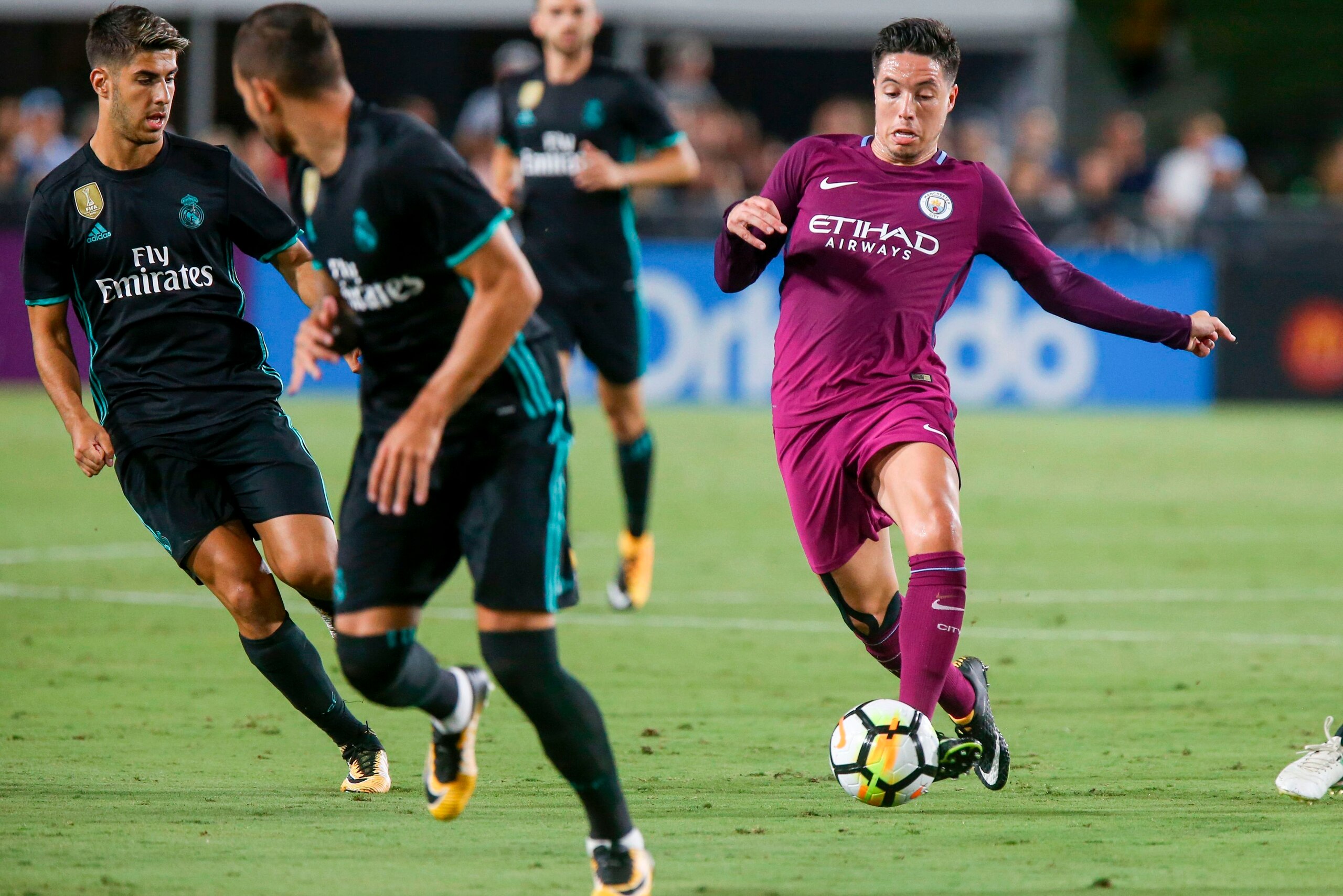 Manchester City midfielder Samir Nasri, right, drives the ball against Real Madrid during the second half of the International Champions Cup match on July 26, 2017 in Los Angeles, California.
Manchester City won 4-1.  / AFP PHOTO / RINGO CHIU        (Phot