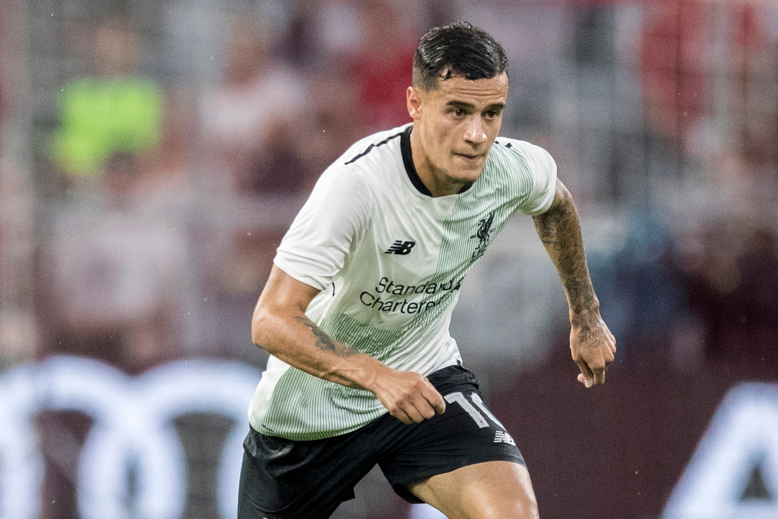 MUNICH, GERMANY - AUGUST 01:  Philippe Coutinho of Liverpool FC runs with the ball during the Audi Cup 2017 match between Bayern Muenchen and Liverpool FC at Allianz Arena on August 1, 2017 in Munich, Germany.  (Photo by Boris Streubel/Getty Images)