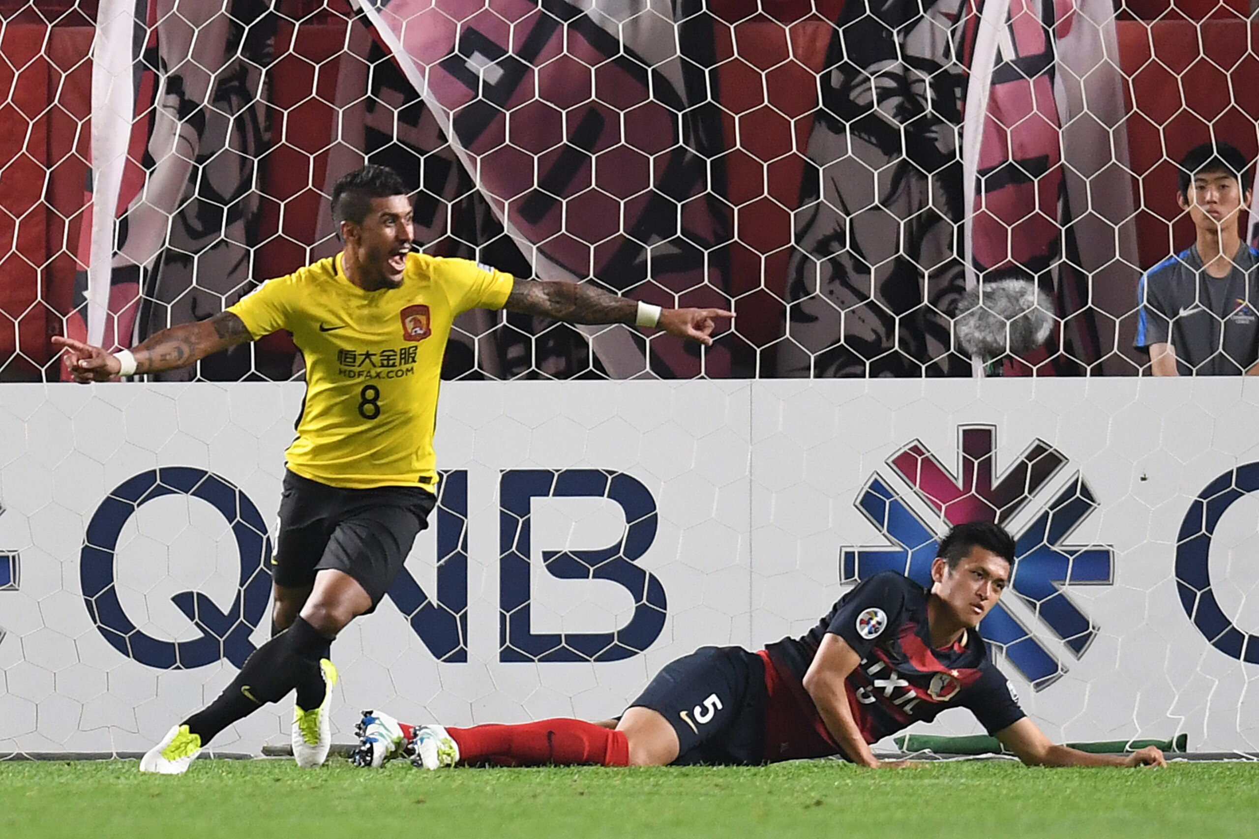 KASHIMA, JAPAN - MAY 30: Paulinho of Guangzhou Evergrande celebrates after scoring a goal during the AFC Champions League Round of 16 match between Kashima Antlers and Guangzhou Evergrande FC at Kashima Stadium on May 30, 2017 in Kashima, Japan. (Photo KASHIMA, JAPAN - MAY 30: Paulinho of Guangzhou Evergrande celebrates after scoring a goal during the AFC Champions League Round of 16 match between Kashima Antlers and Guangzhou Evergrande FC at Kashima Stadium on May 30, 2017 in Kashima, Japan. (Photo