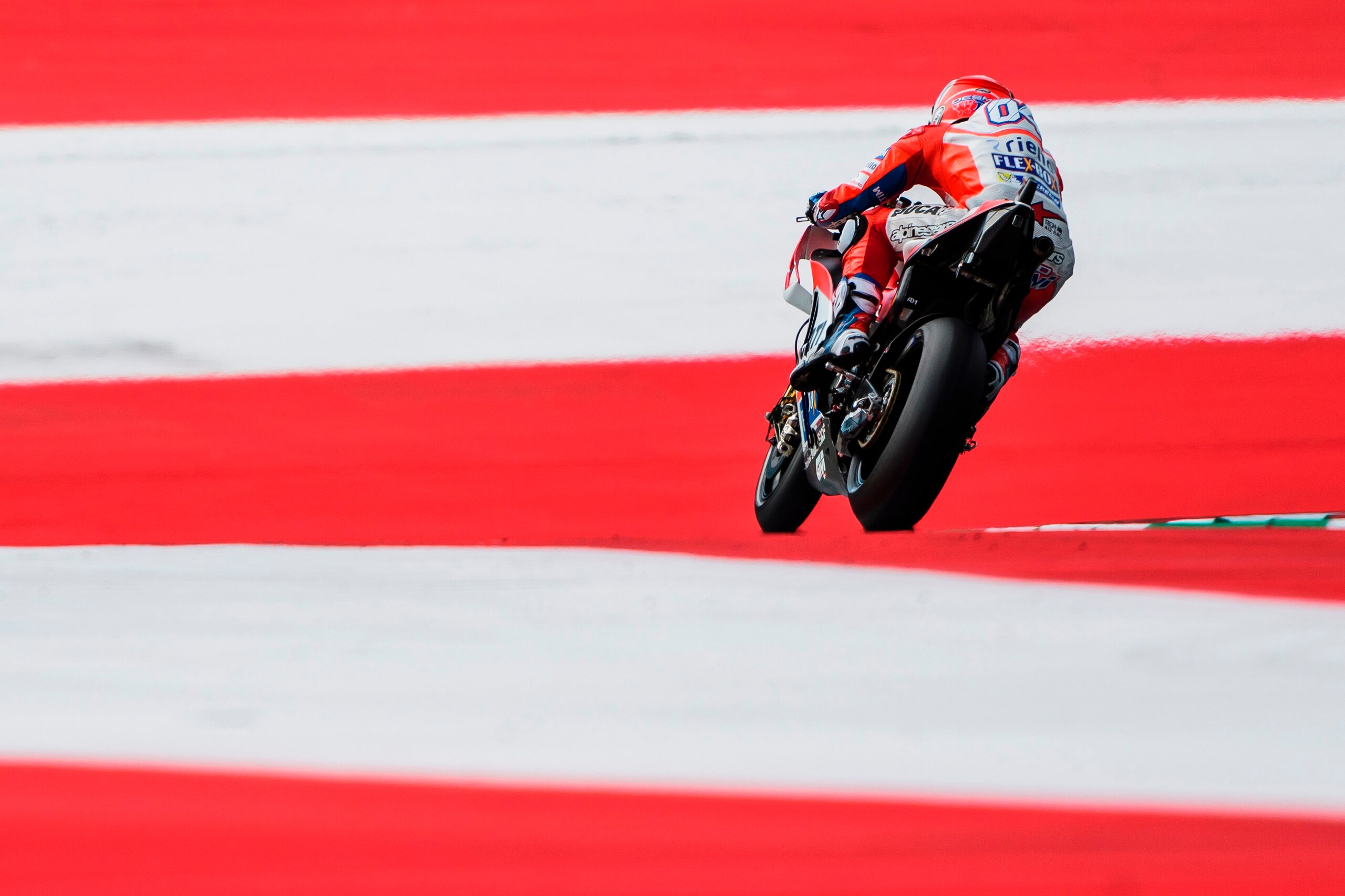 Ducati Team's Italian rider Andrea Dovizioso competes during the warm up session prior to the MotoGP Austrian Grand Prix race at Red Bull Ring in Spielberg, Austria on August 13, 2017. / AFP PHOTO / Jure Makovec        (Photo credit should read JURE MAKOV