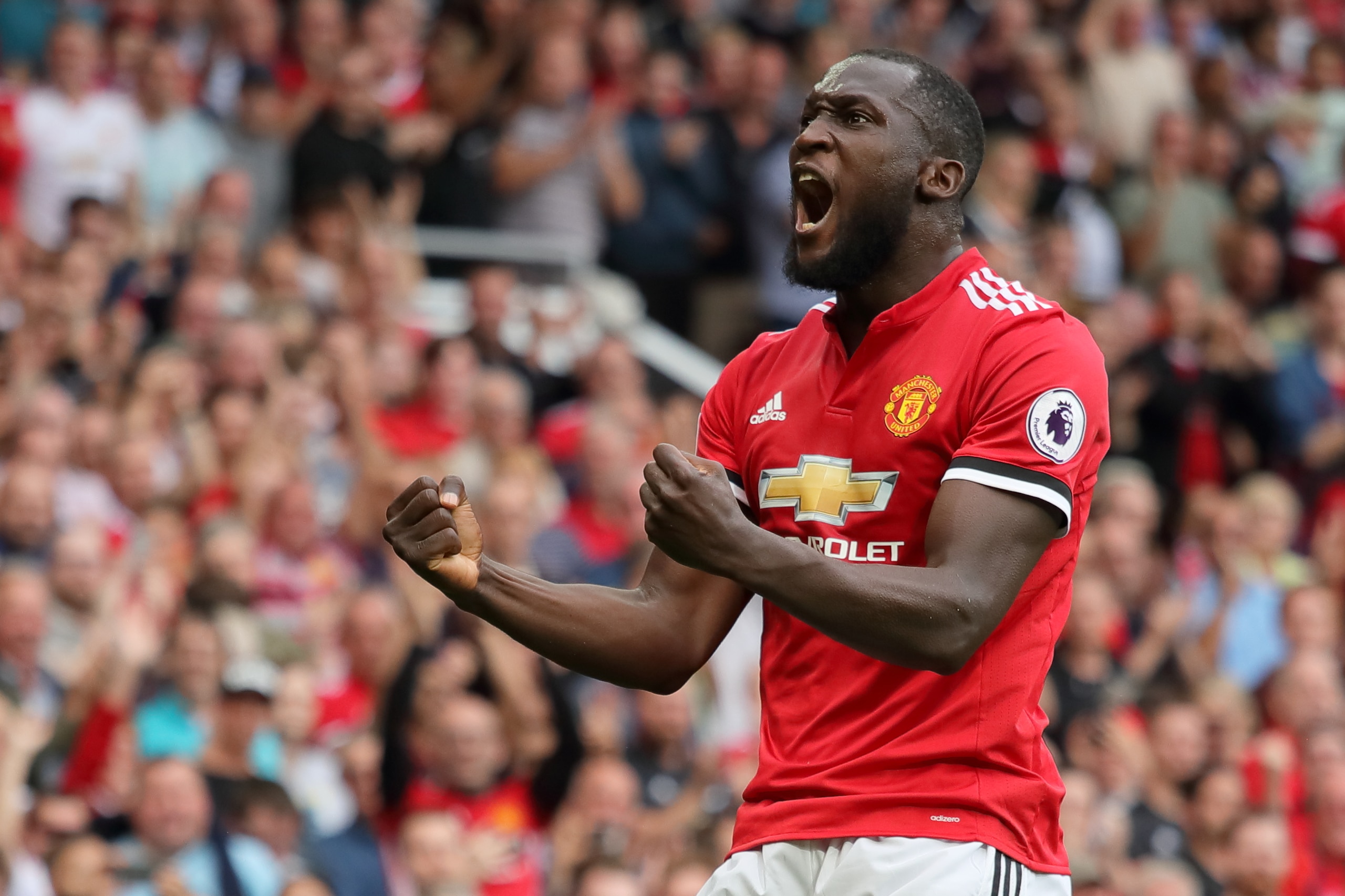 MANCHESTER, ENGLAND - AUGUST 13: Romelu Lukaku of Manchester United celebrates after scoring a goal to make it 1-0 during the Premier League match between Manchester United and West Ham United at Old Trafford on August 13, 2017 in Manchester, England. (Ph