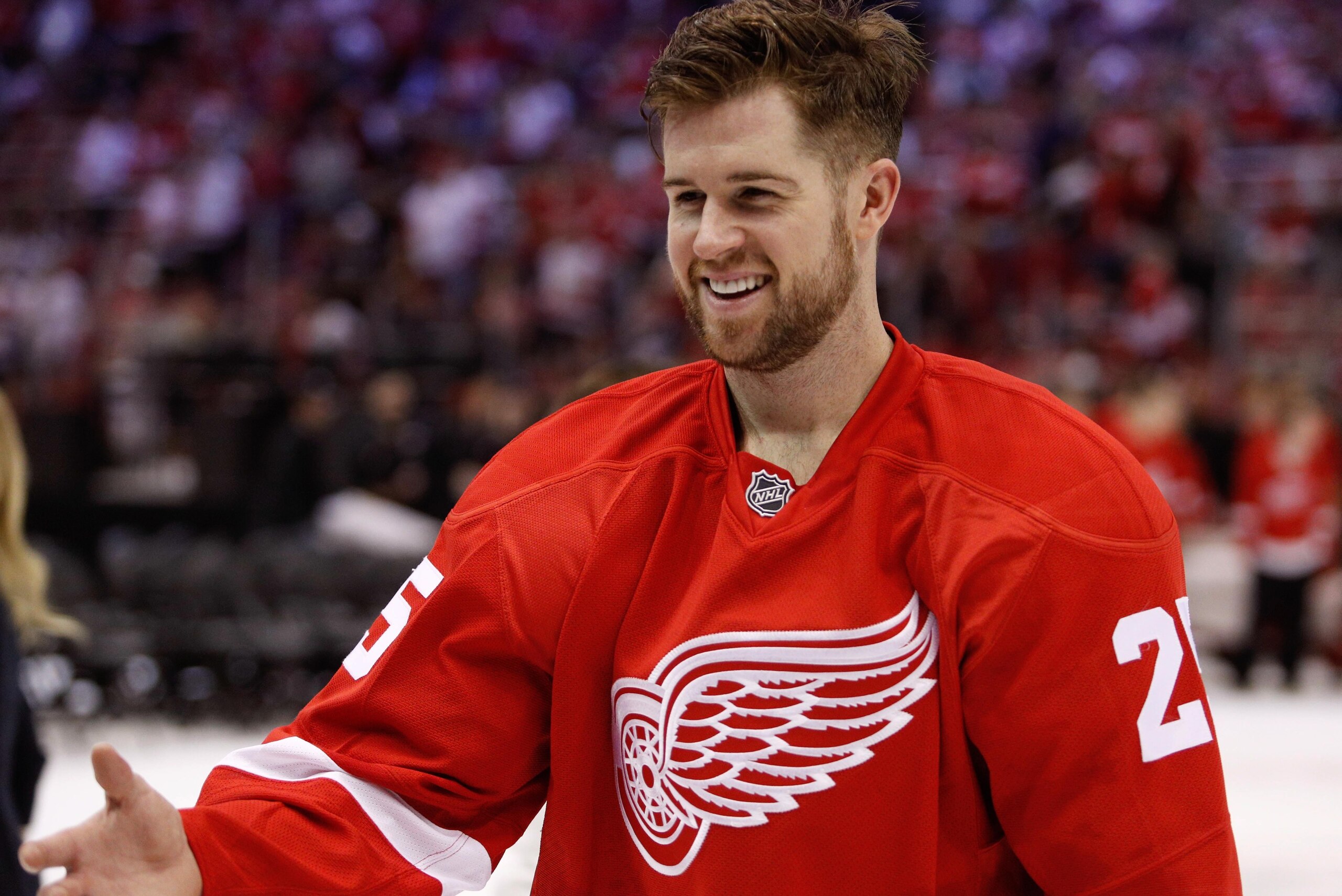 Apr 9, 2017; Detroit, MI, USA; Detroit Red Wings defenseman Mike Green (25) smiles before giving his jersey away after the game against the New Jersey Devils at Joe Louis Arena. The Red Wings won 4-1 in their final game at the Joe. Mandatory Credit: Raj M