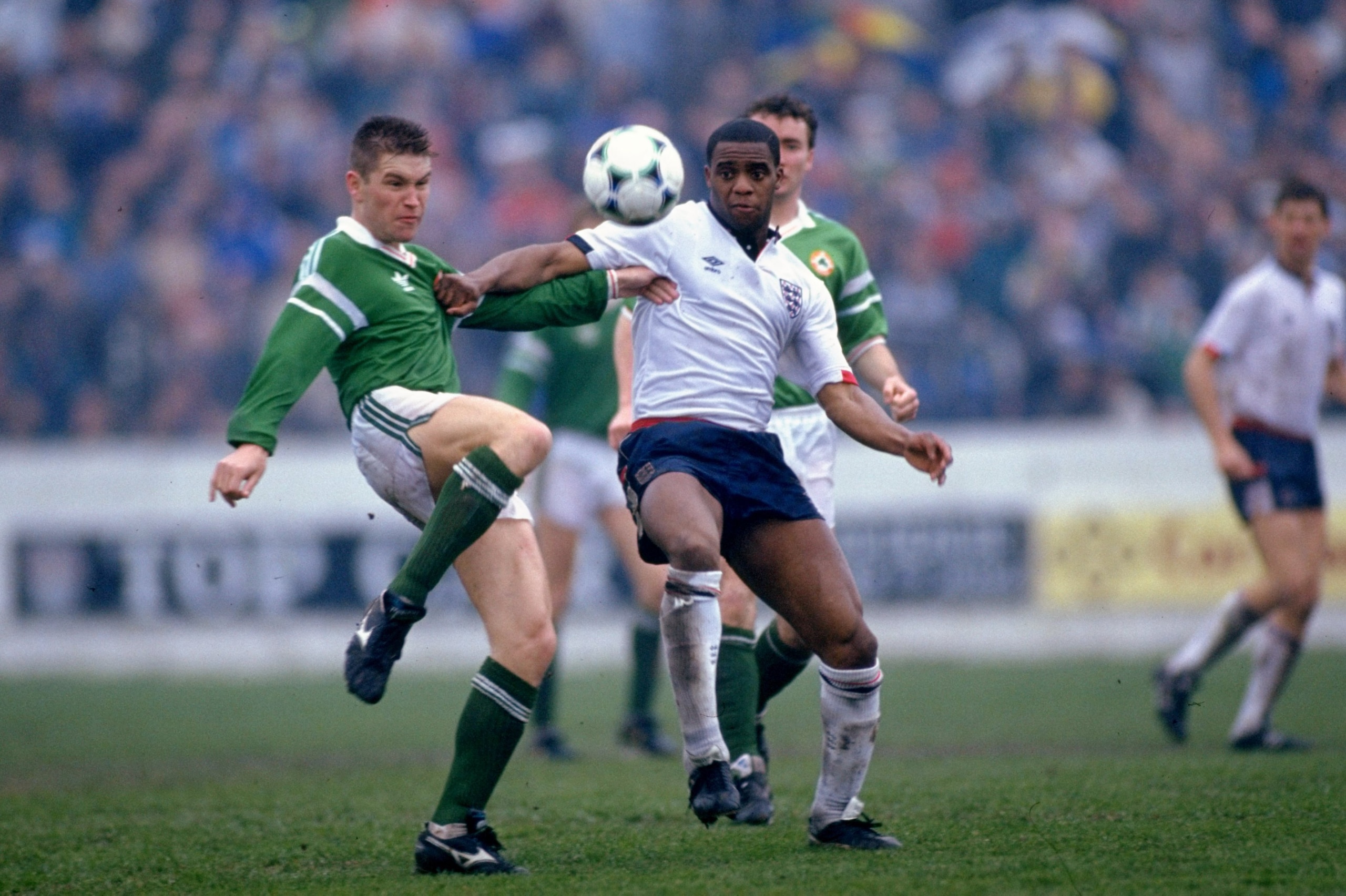 27 Mar 1990:  Derek Brazil of the Republic of Ireland takes on Dalian Atkinson of England B during a match in the Republic of Ireland.  \ Mandatory Credit: Ben  Radford/Allsport