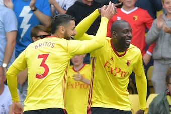 Watford's Italian striker Stefano Okaka (R) celebrates scoring the opening goal during the English Premier League football match between Watford and Liverpool at Vicarage Road Stadium in Watford, north of London on August 12, 2017. / AFP PHOTO / OLLY GREE