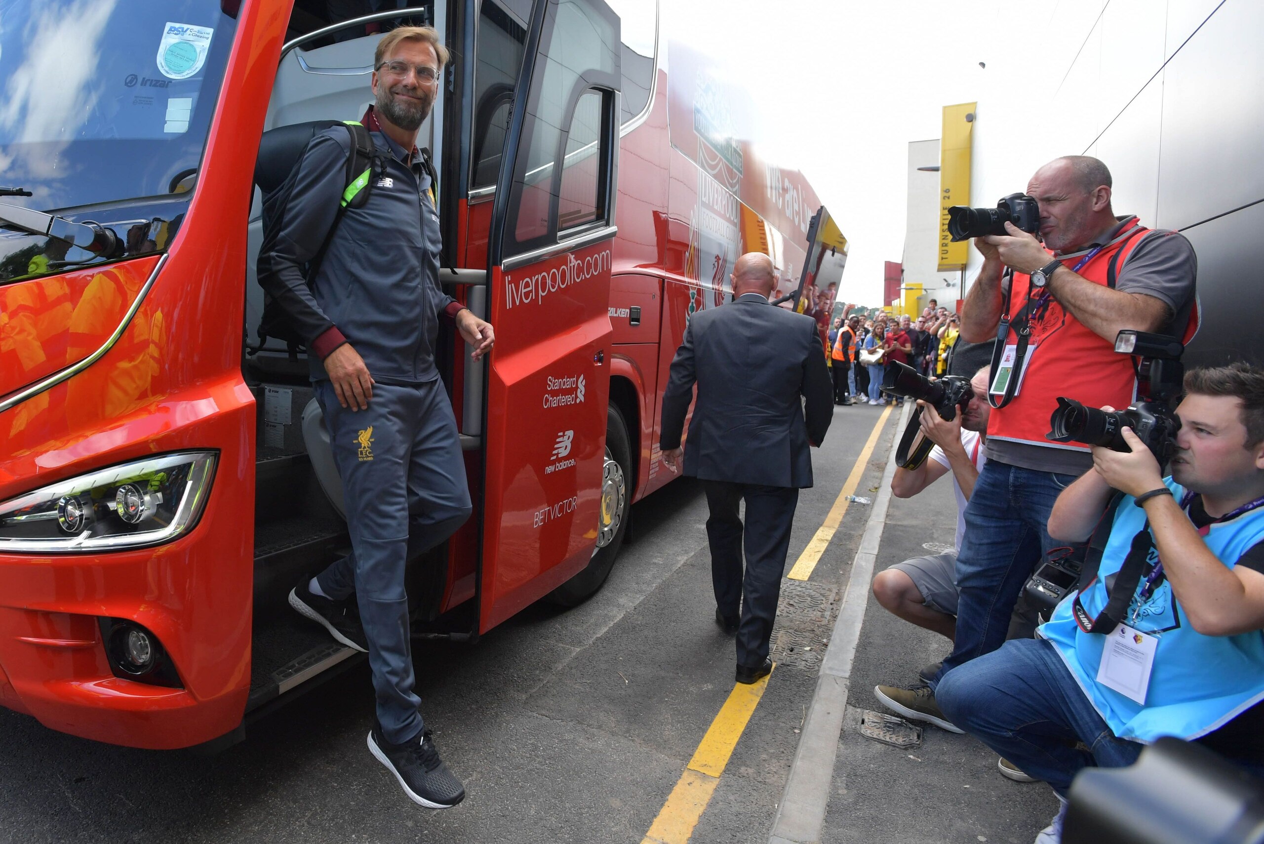 Liverpool's German manager Jurgen Klopp steps off the team bus as he arrives ahead of the English Premier League football match between Watford and Liverpool at Vicarage Road Stadium in Watford, north of London on August 12, 2017. / AFP PHOTO / OLLY GREEN