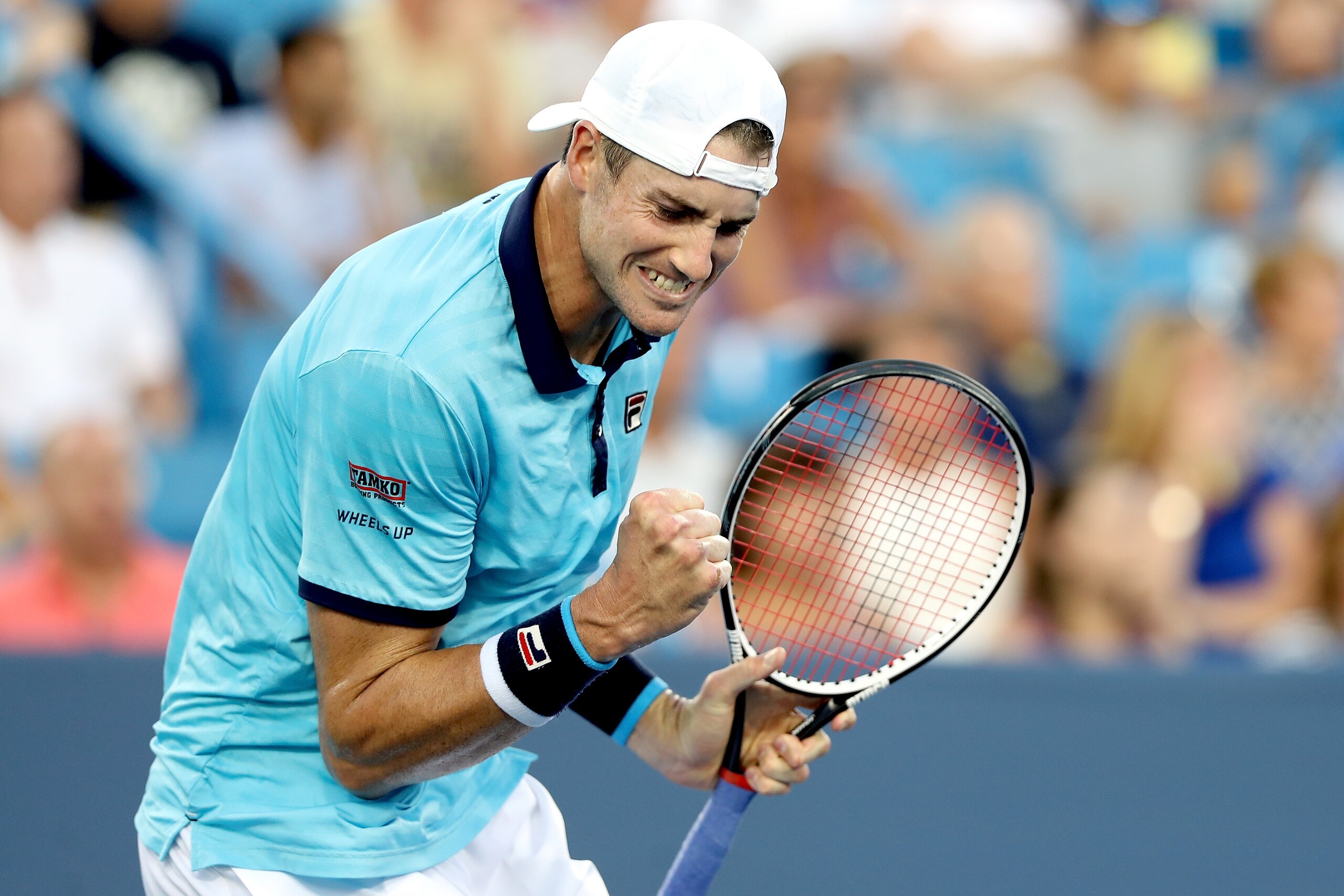 MASON, OH - AUGUST 13:  John Isner celebrates a point against Viktor Troiki of Serbia during the Western & Southern Open at the Lindner Family Tennis Center on August 13, 2017 in Mason, Ohio.  (Photo by Matthew Stockman/Getty Images)