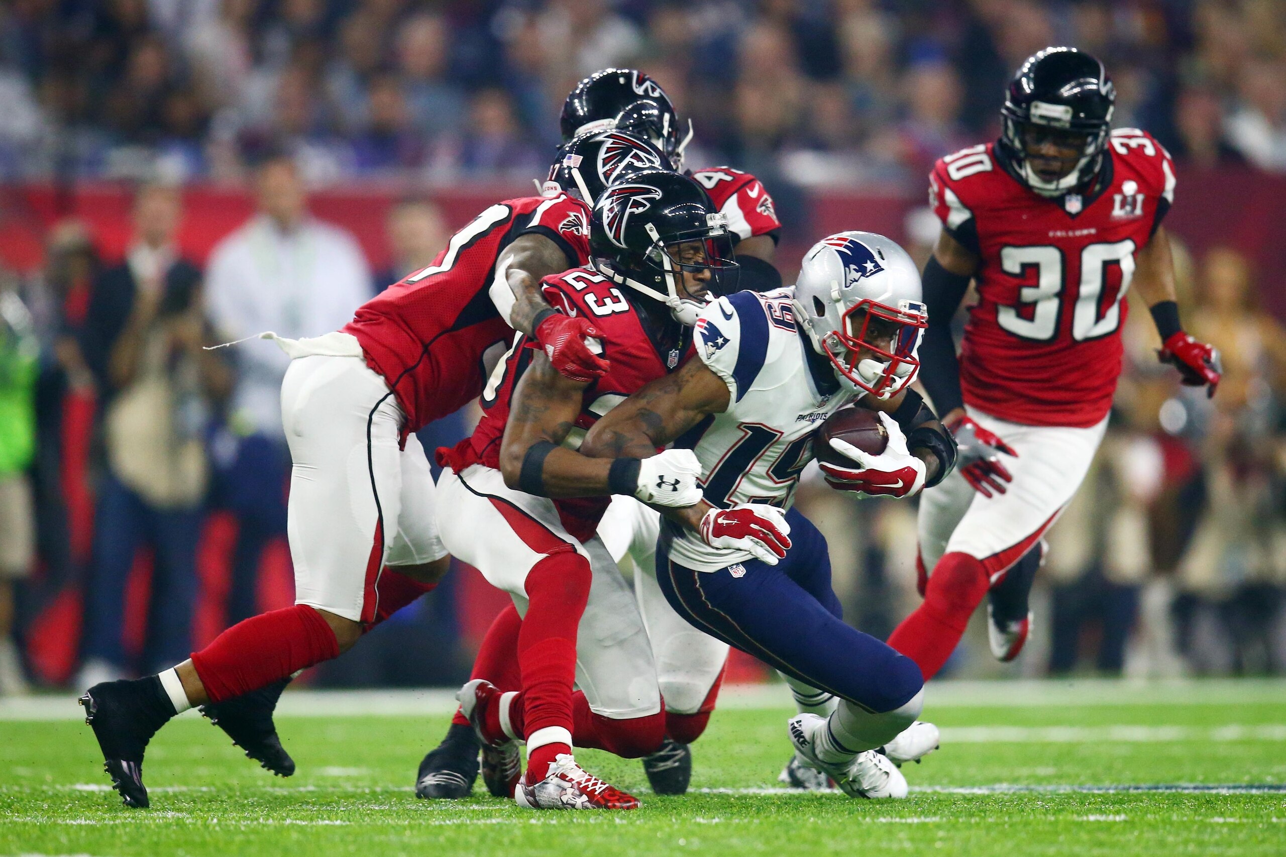 Feb 5, 2017; Houston, TX, USA; New England Patriots wide receiver Malcolm Mitchell (19) is tackled by Atlanta Falcons cornerback Robert Alford (23) in the fourth quarter during Super Bowl LI at NRG Stadium. Mandatory Credit: Mark J. Rebilas-USA TODAY Spor