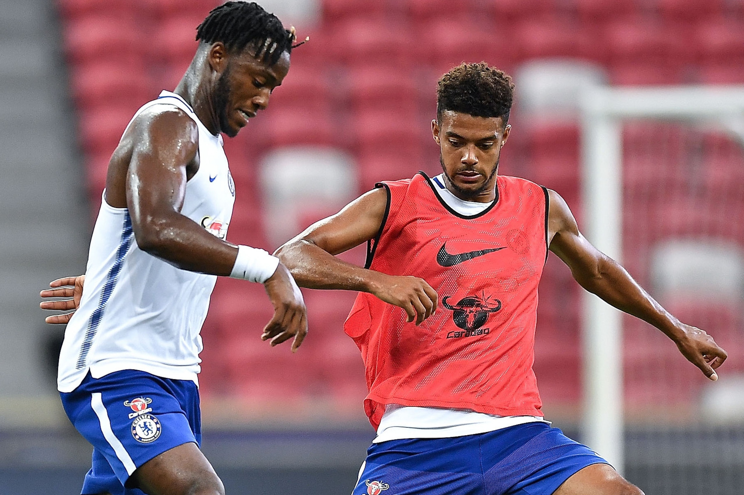 SINGAPORE - JULY 24: Michy Batshuayi and Jake Clarke-Salter of Chelsea FC competes during a Chelsea FC International Champions Cup training session at National Stadium on July 24, 2017 in Singapore.  (Photo by Thananuwat Srirasant/Getty Images  for ICC)