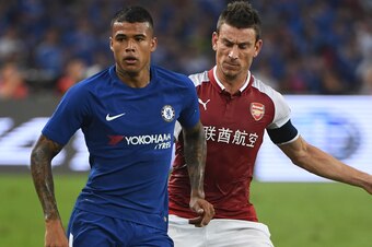 This photo taken on July 22, 2017 shows Chelsea's Kenedy (L) competing for the ball with Arsenal's Laurent Koscielny during their pre-season football match in Beijing's National Stadium. 
Kenedy was sent home from Chelsea's pre-season tour of Asia as puni