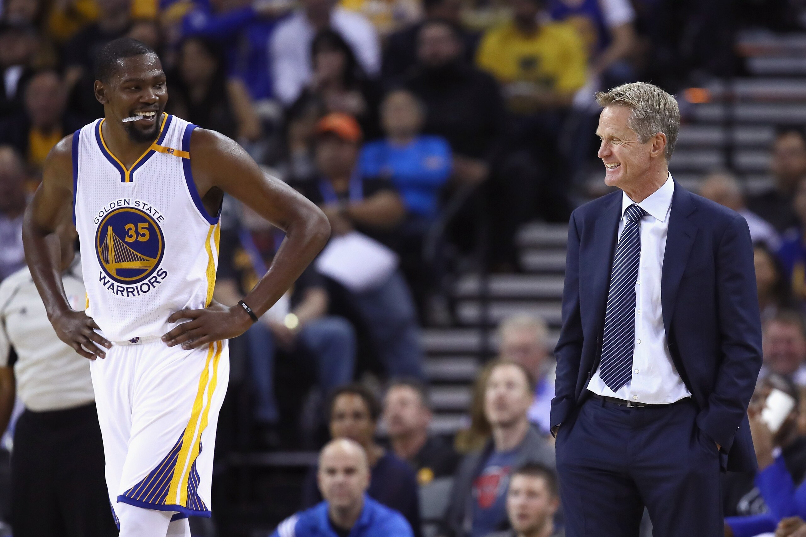 OAKLAND, CA - OCTOBER 04:  Head coach Steve Kerr of the Golden State Warriors talks to Kevin Durant #35 during their preseason game against the Los Angeles Clippers at ORACLE Arena on October 4, 2016 in Oakland, California.  NOTE TO USER: User expressly a