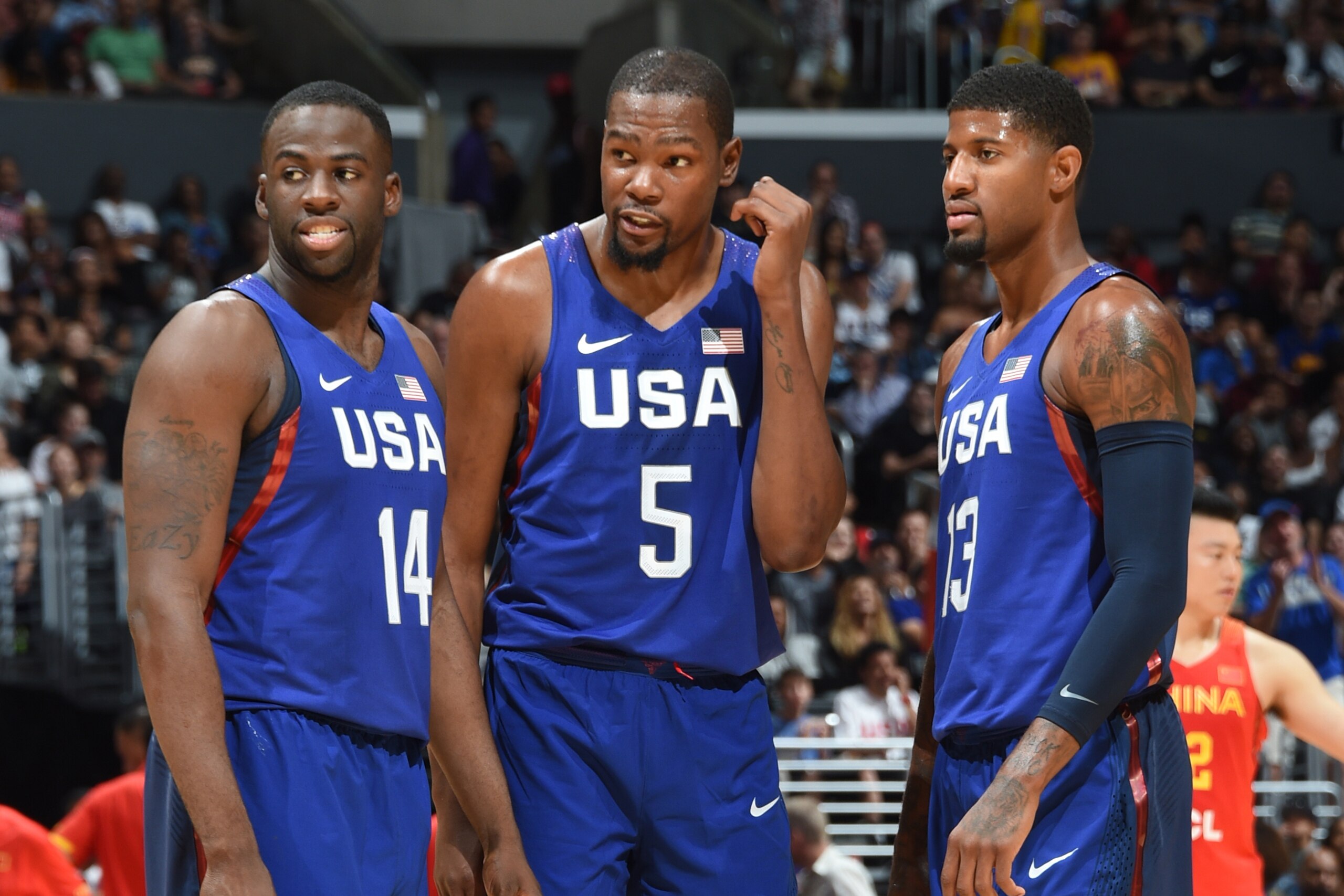 LOS ANGELES, CA - JULY 24: Draymond Green #14, Kevin Durant #5 and Paul George #13 of the USA Basketball Men's National Team are seen against China at the Staples Center in Los Angeles, California. NOTE TO USER: User expressly acknowledges and agrees that