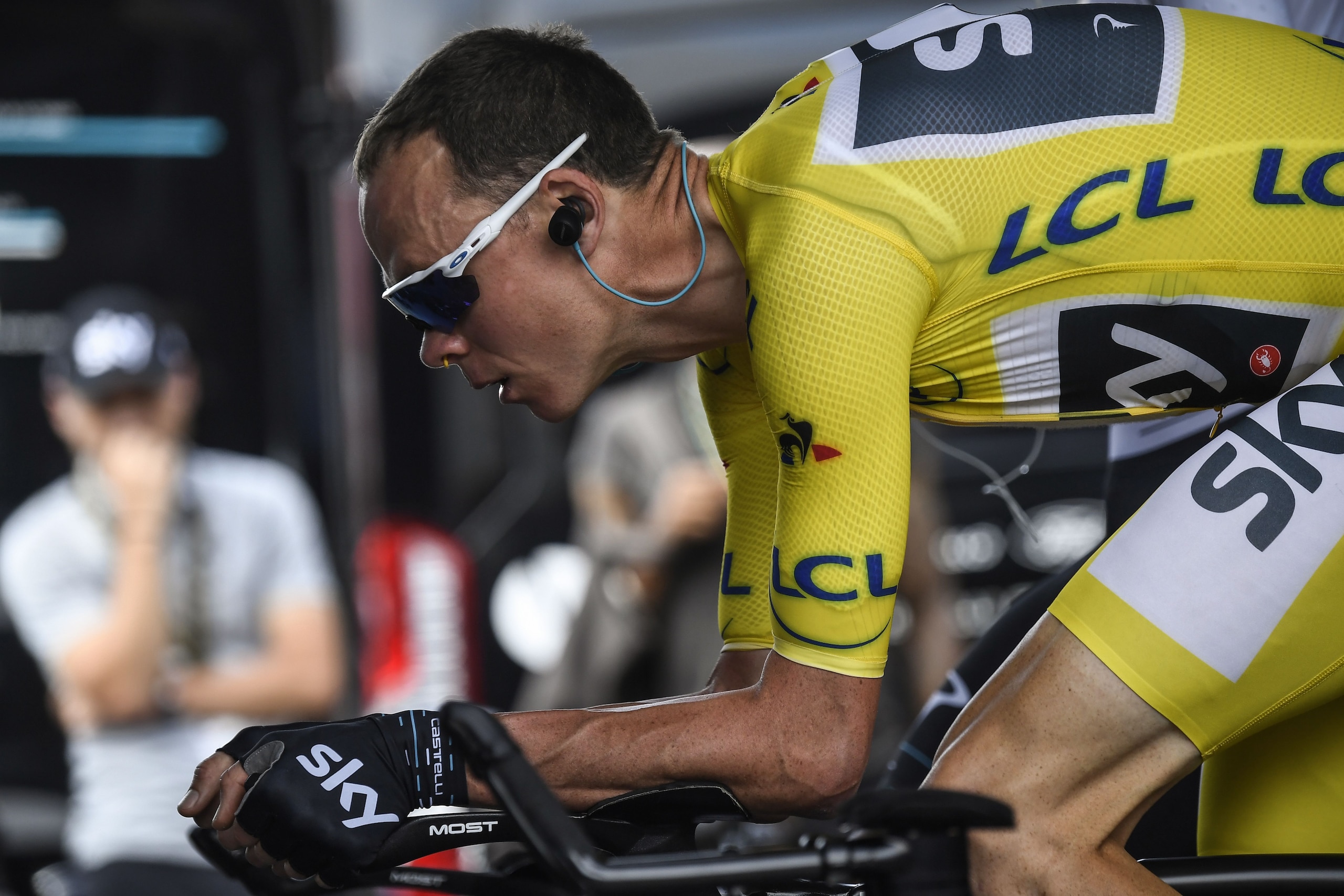 TOPSHOT - Great Britain's Christopher Froome wearing the overall leader's yellow jersey trains prior to taking the start of a 22,5 km individual time-trial, the twentieth stage of the 104th edition of the Tour de France cycling race on July 22, 2017 in an
