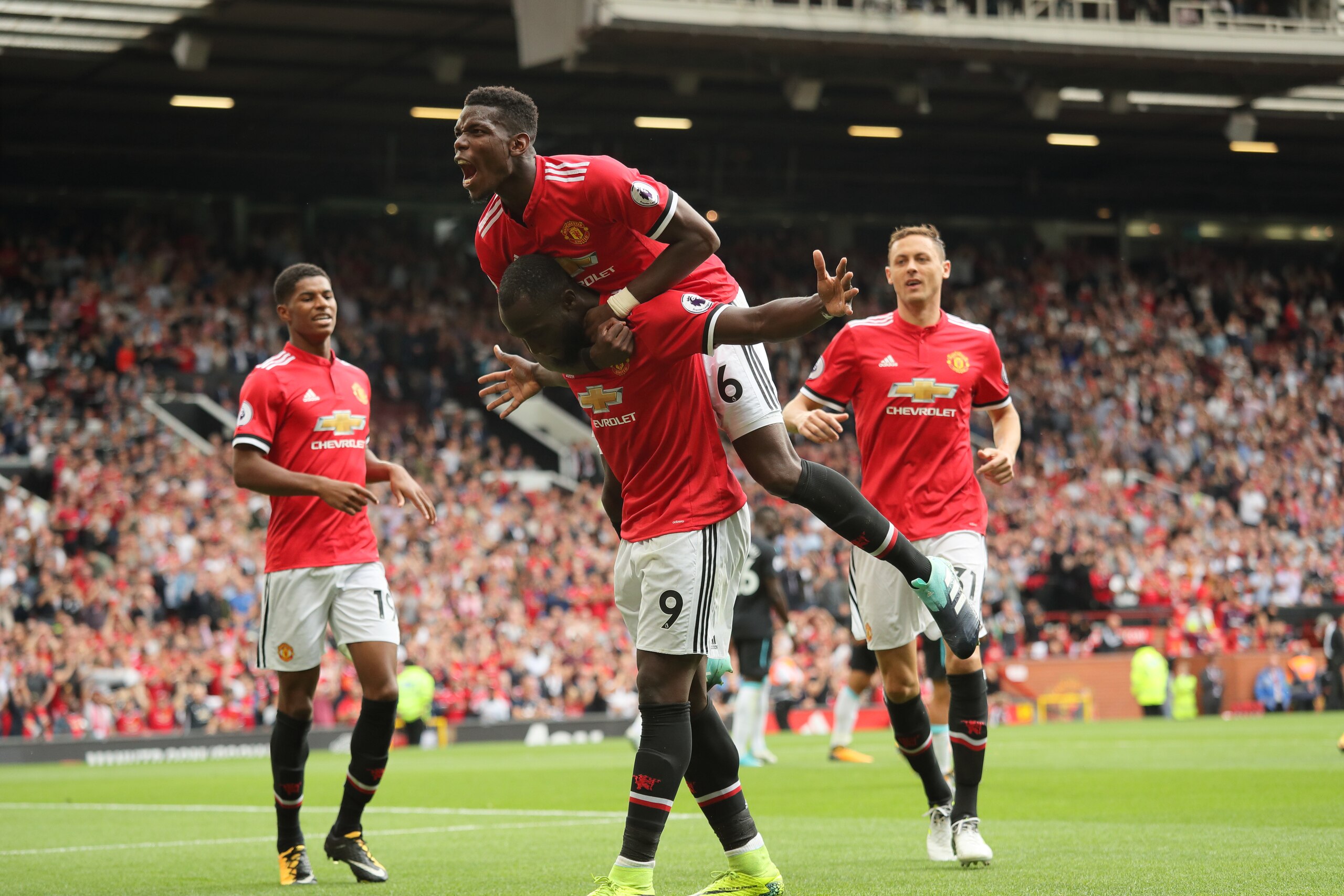 MANCHESTER, ENGLAND - AUGUST 13: Romelu Lukaku of Manchester United celebrates after scoring a goal to make it 2-0 during the Premier League match between Manchester United and West Ham United at Old Trafford on August 13, 2017 in Manchester, England. (Ph