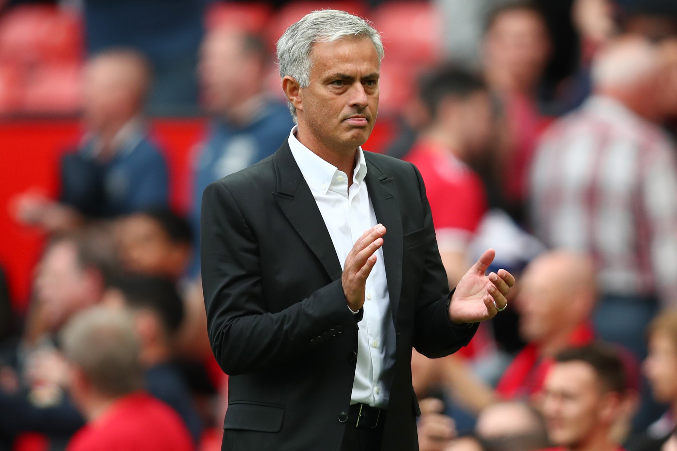 MANCHESTER, ENGLAND - AUGUST 13:  Jose Mourinho, Manager of Manchester United shows appreciation to the fans after the Premier League match between Manchester United and West Ham United at Old Trafford on August 13, 2017 in Manchester, England.  (Photo by