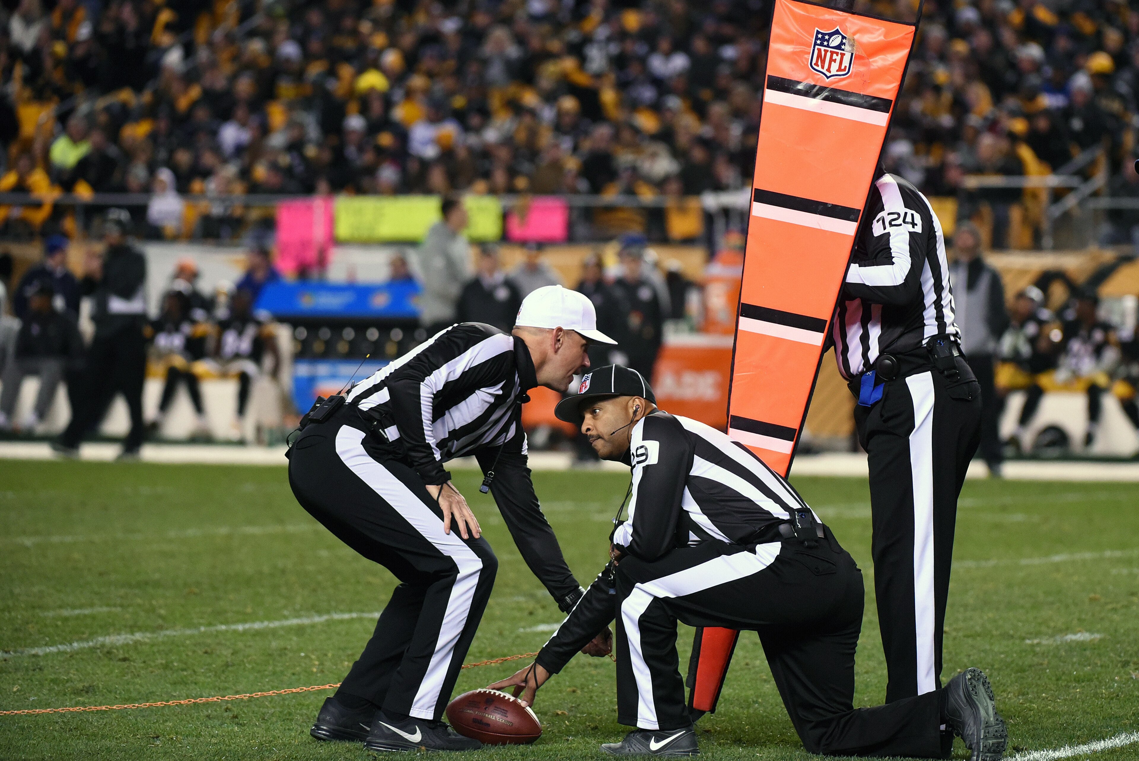 PITTSBURGH, PA - NOVEMBER 13: National Football League officials, referee Clete Blakeman (white hat), field judge Adrian Hill #29 and umpire Carl Paganelli #124, measure for a first down during a game between the Dallas Cowboys and the Pittsburgh Steelers PITTSBURGH, PA - NOVEMBER 13: National Football League officials, referee Clete Blakeman (white hat), field judge Adrian Hill #29 and umpire Carl Paganelli #124, measure for a first down during a game between the Dallas Cowboys and the Pittsburgh Steelers