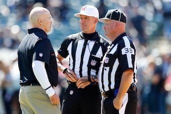 OAKLAND, CA - SEPTEMBER 18:  Head coach Dan Quinn of the Atlanta Falcons  speaks with referee Clete Blakeman and field judge Steve Zimmer prior to their NFL game against the Oakland Raiders at Oakland-Alameda County Coliseum on September 18, 2016 in Oakla