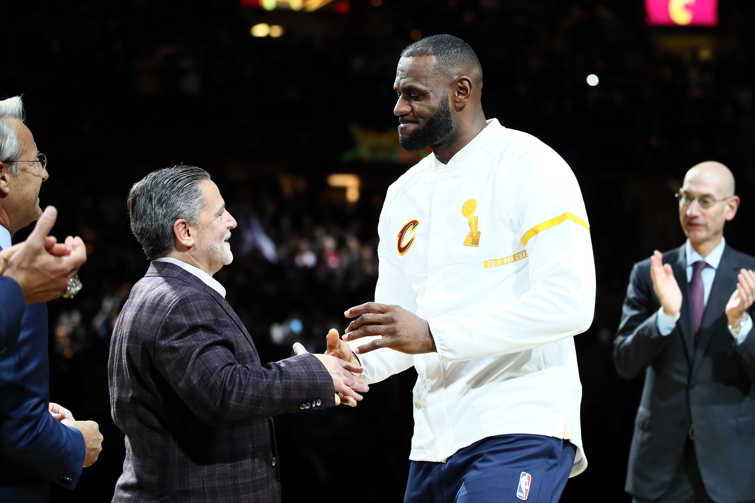 CLEVELAND, OH - OCTOBER 25: LeBron James #23 of the Cleveland Cavaliers recieves his championship ring from owner Dan Gilbert before the game against the New York Knicks at Quicken Loans Arena on October 25, 2016 in Cleveland, Ohio.   NOTE TO USER: User e