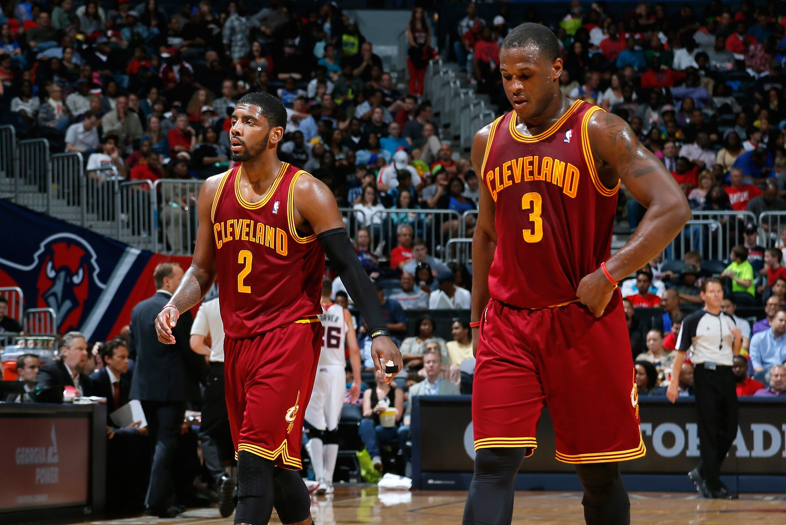 ATLANTA, GA - APRIL 04:  Kyrie Irving #2 and Dion Waiters #3 of the Cleveland Cavaliers walk off the court between free throws in their 117-98 loss to the Atlanta Hawks at Philips Arena on April 4, 2014 in Atlanta, Georgia.  NOTE TO USER: User expressly a