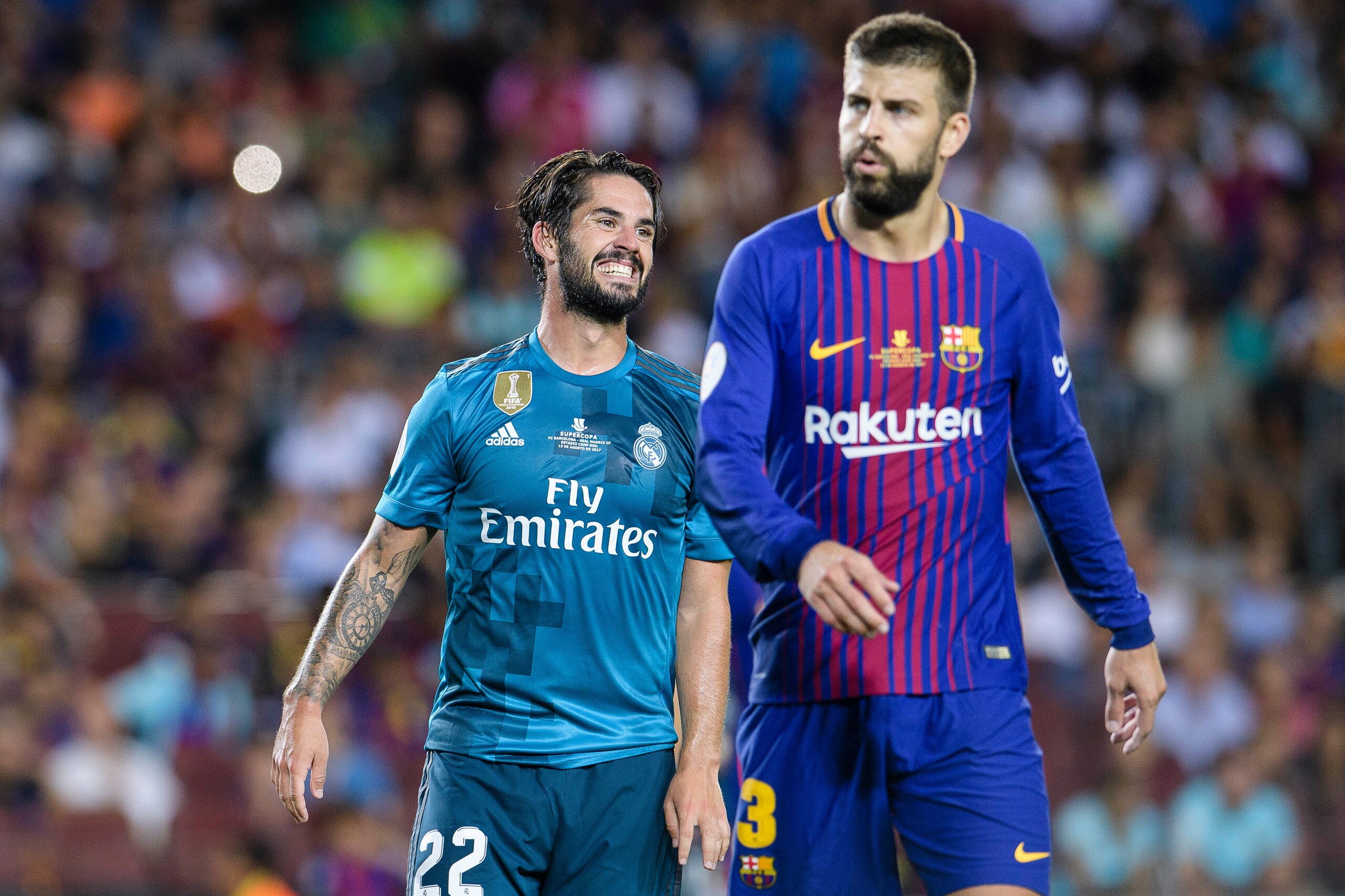 BARCELONA, SPAIN - AUGUST 13: Isco Alarcon of Real Madrid (L) and Gerard Pique Bernabeu of FC Barcelona (R) during the Supercopa de Espana Final 1st Leg match between FC Barcelona and Real Madrid at Camp Nou on August 13, 2017 in Barcelona, Spain. (Photo 