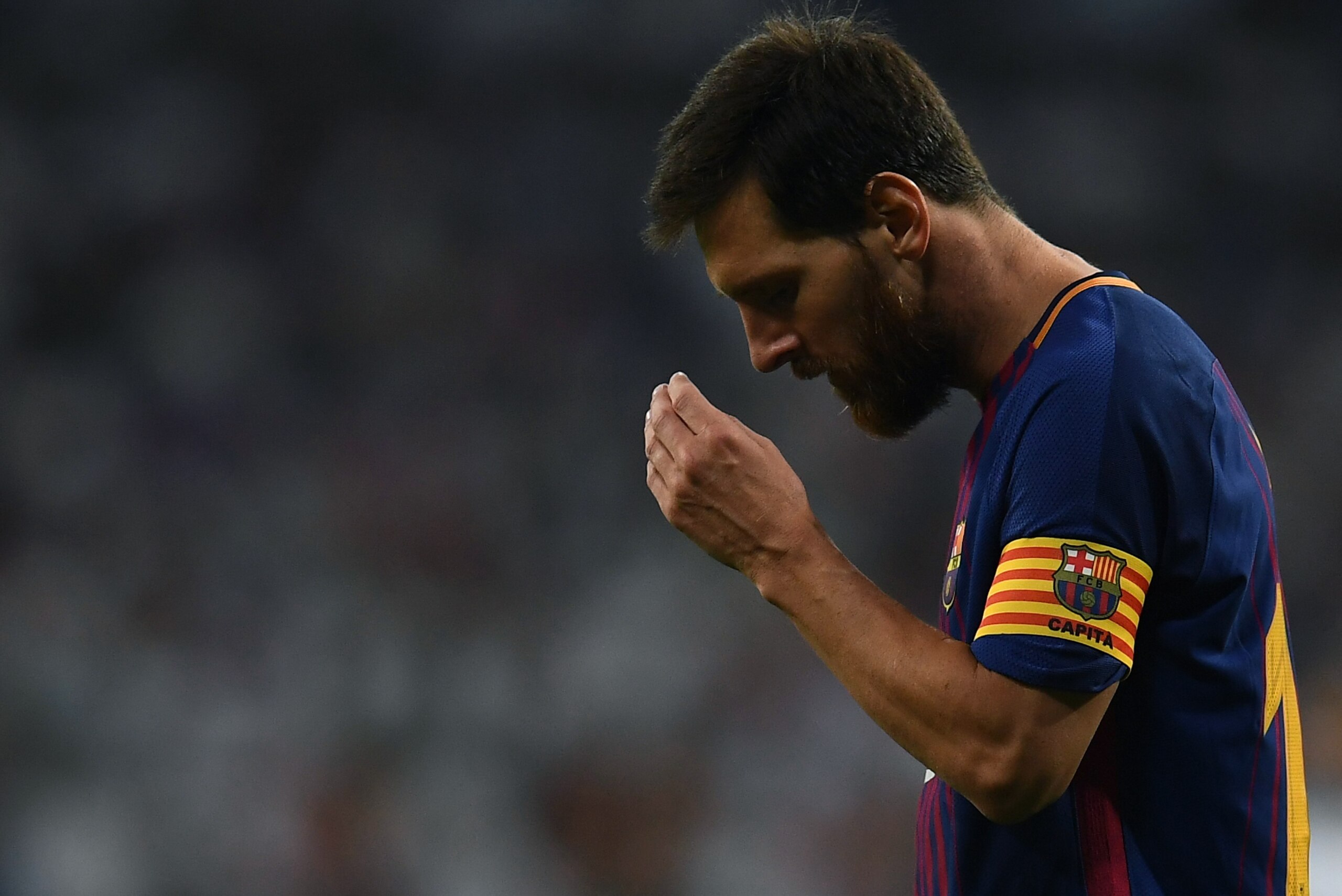 Barcelona's Argentinian forward Lionel Messi gestures during the second leg of the Spanish Supercup football match Real Madrid vs FC Barcelona at the Santiago Bernabeu stadium in Madrid, on August 16, 2017. / AFP PHOTO / GABRIEL BOUYS        (Photo credit