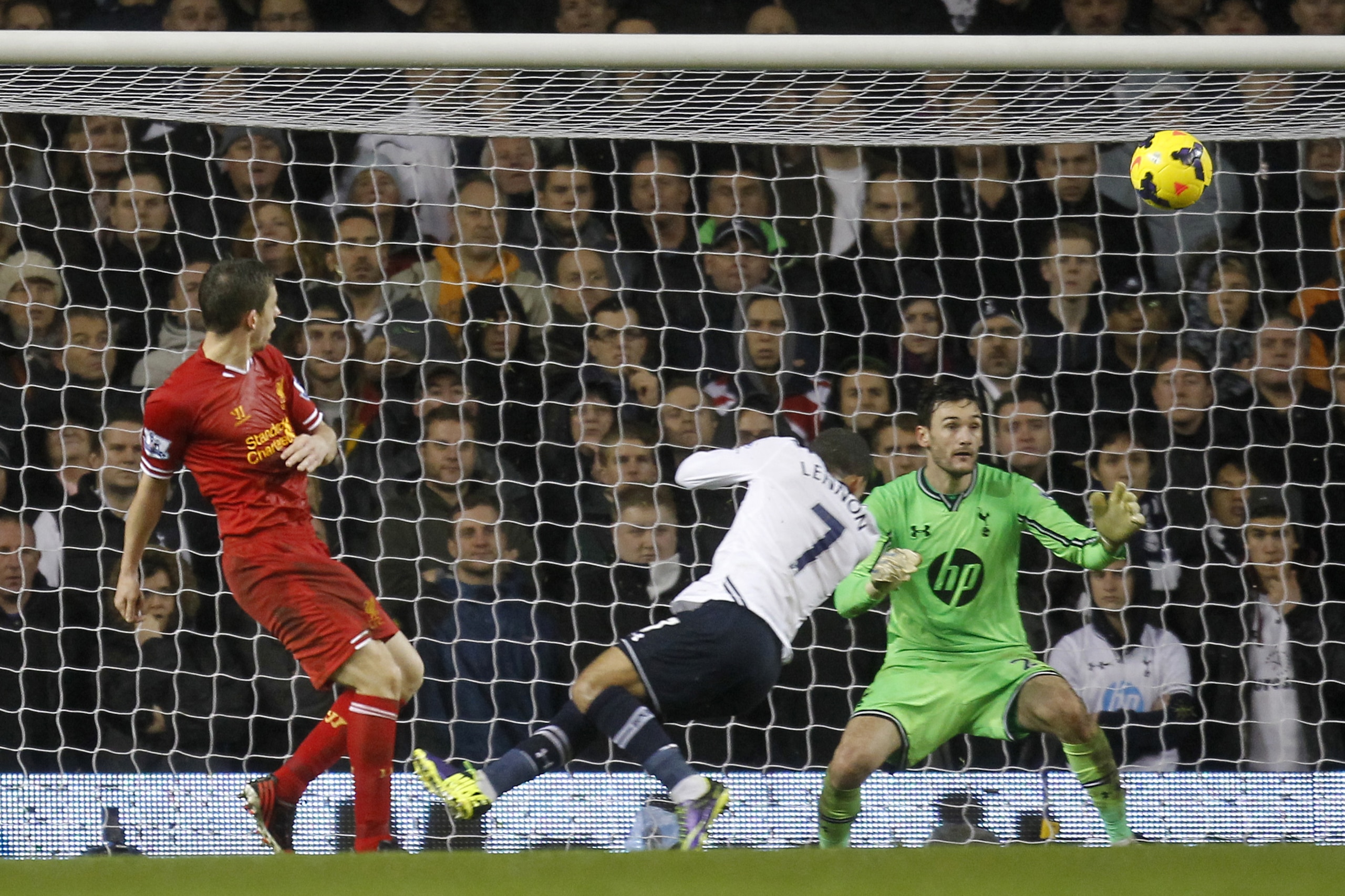 Liverpool's English defender Jon Flanagan (L) scores a goal  during the English Premier League football match between Tottenham Hotspur and Liverpool at White Hart Lane in London, England, on December 15, 2013.  Liverpool won 5-0.   AFP PHOTO/IAN KINGTON 