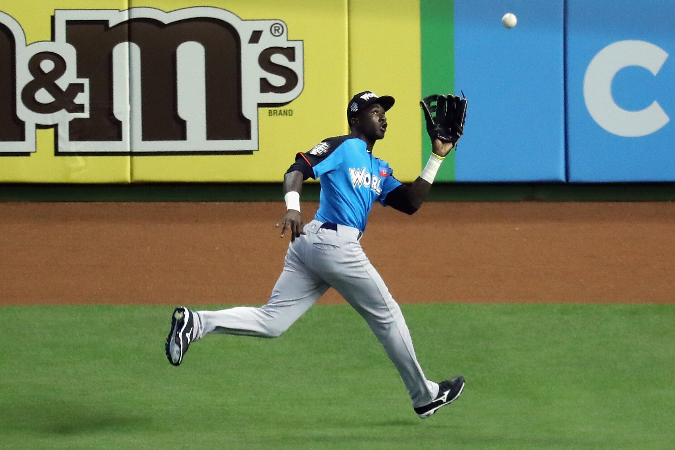 MIAMI, FL - JULY 09:  Estevan Florial #8 of the New York Yankees and the World Team catches a ball hits a by Bo Bichette #10 of the Toronto Blue Jays and the U.S. Team for an out in the fifth inning during the SiriusXM All-Star Futures Game at Marlins Par