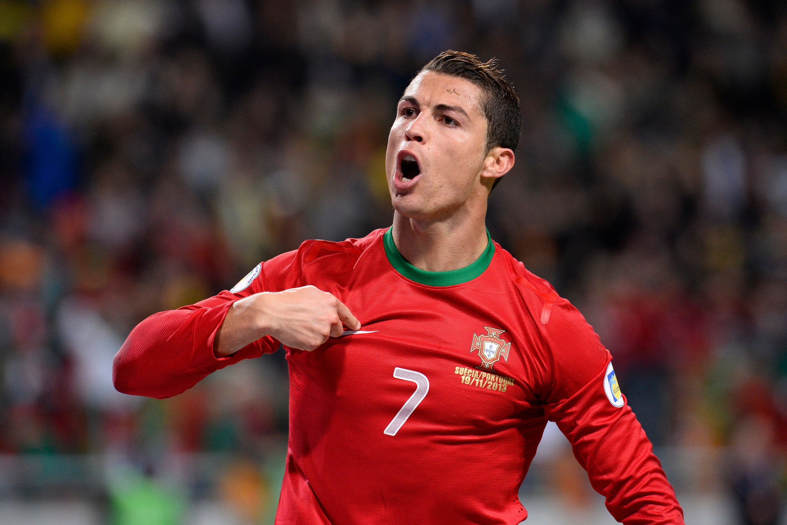 Portugal's forward Cristiano Ronaldo celebrates after scoring the second goal for Portugal during the FIFA 2014 World Cup playoff football match Sweden vs Portugal at the Friends Arena in Solna near Stockholm on November 19, 2013 . AFP PHOTO/ JONATHAN NAC
