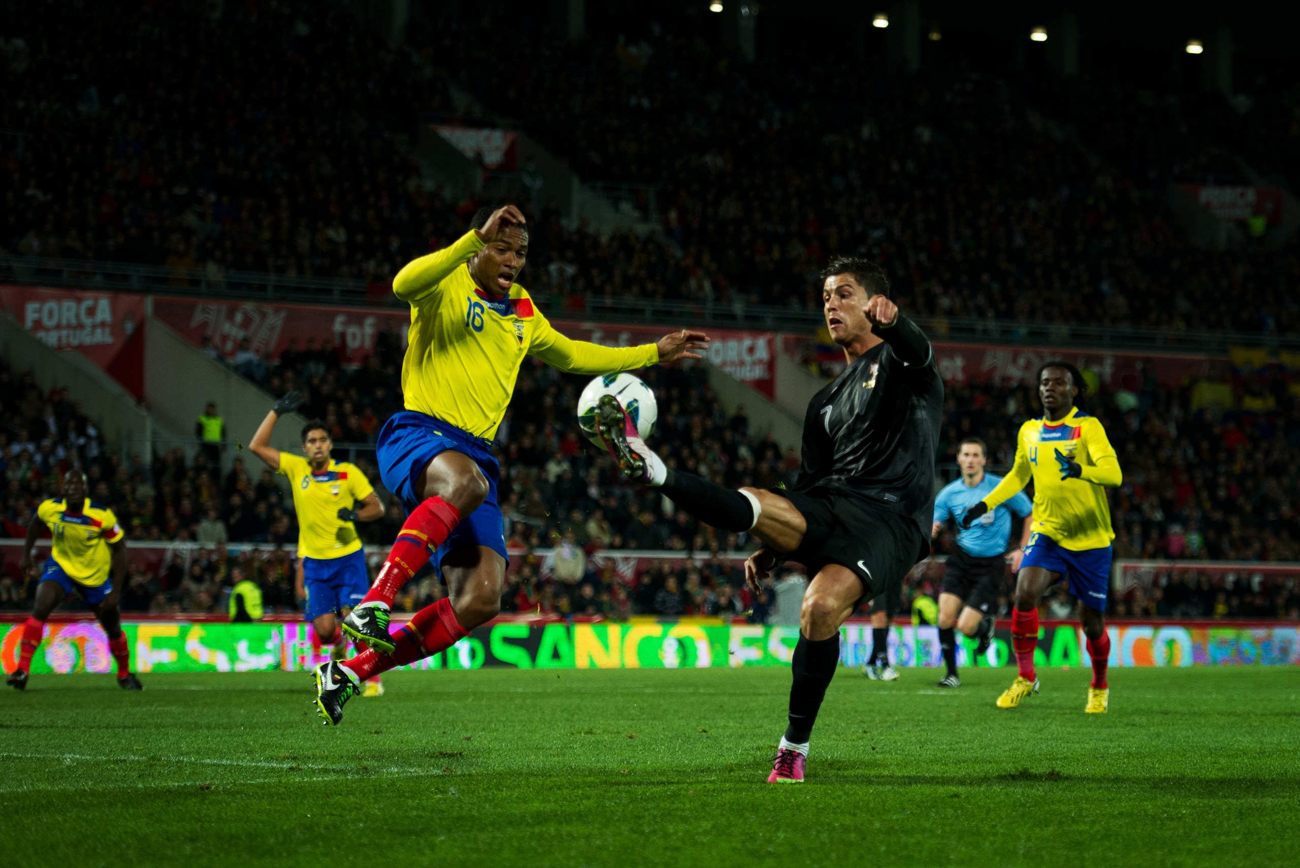 GUIMARAES, PORTUGAL - FEBRUARY 06: Cristiano Ronaldo (R) of Portugal duels for the ball with Luis Antonio Valencia of Ecuador during the international friendly match between Portugal and Ecuador at the Estadio Dom Afonso Henriques on February 6, 2013 in G