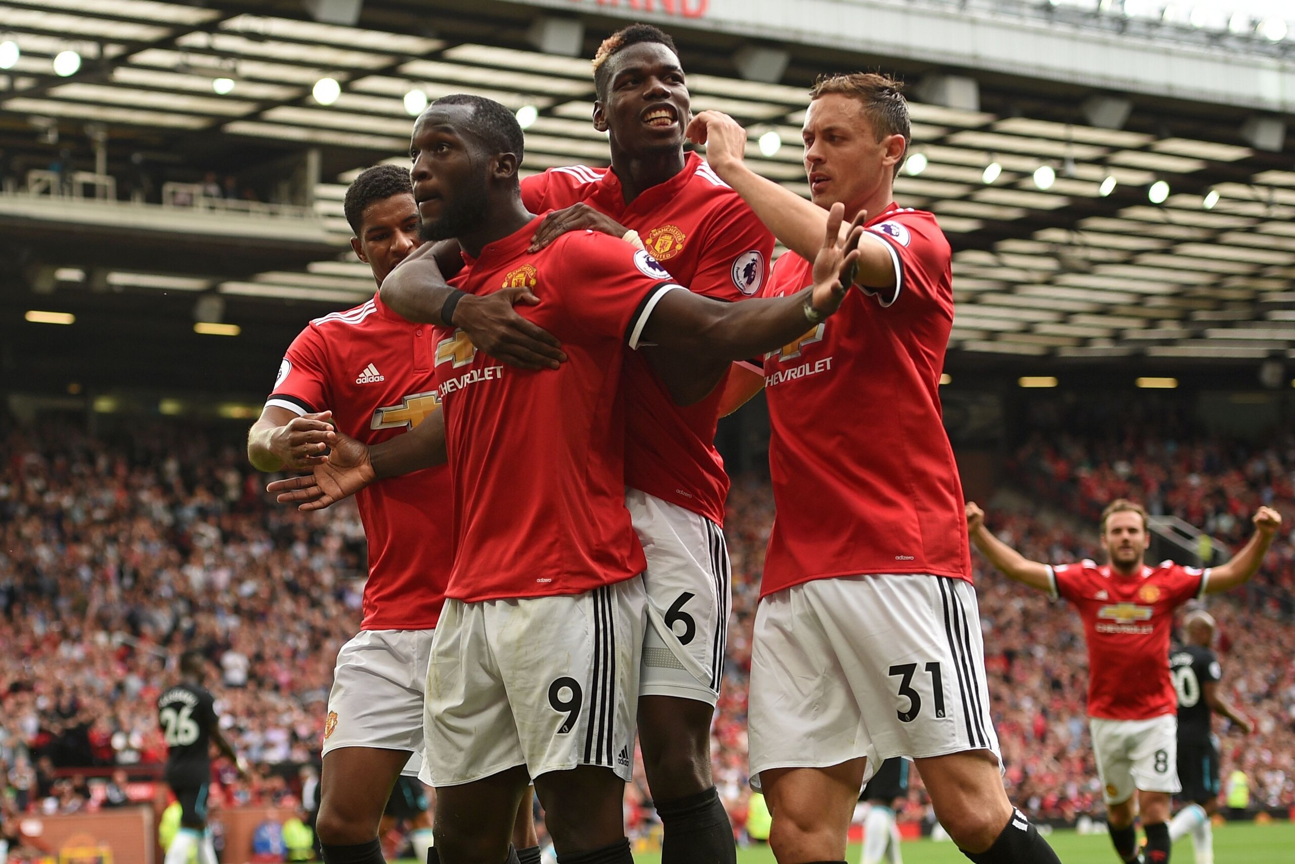 Manchester United's Belgian striker Romelu Lukaku (2L) celebrates scoring his team's second goal with Manchester United's English striker Marcus Rashford (L), Manchester United's French midfielder Paul Pogba (2R) and Manchester United's Serbian midfielder