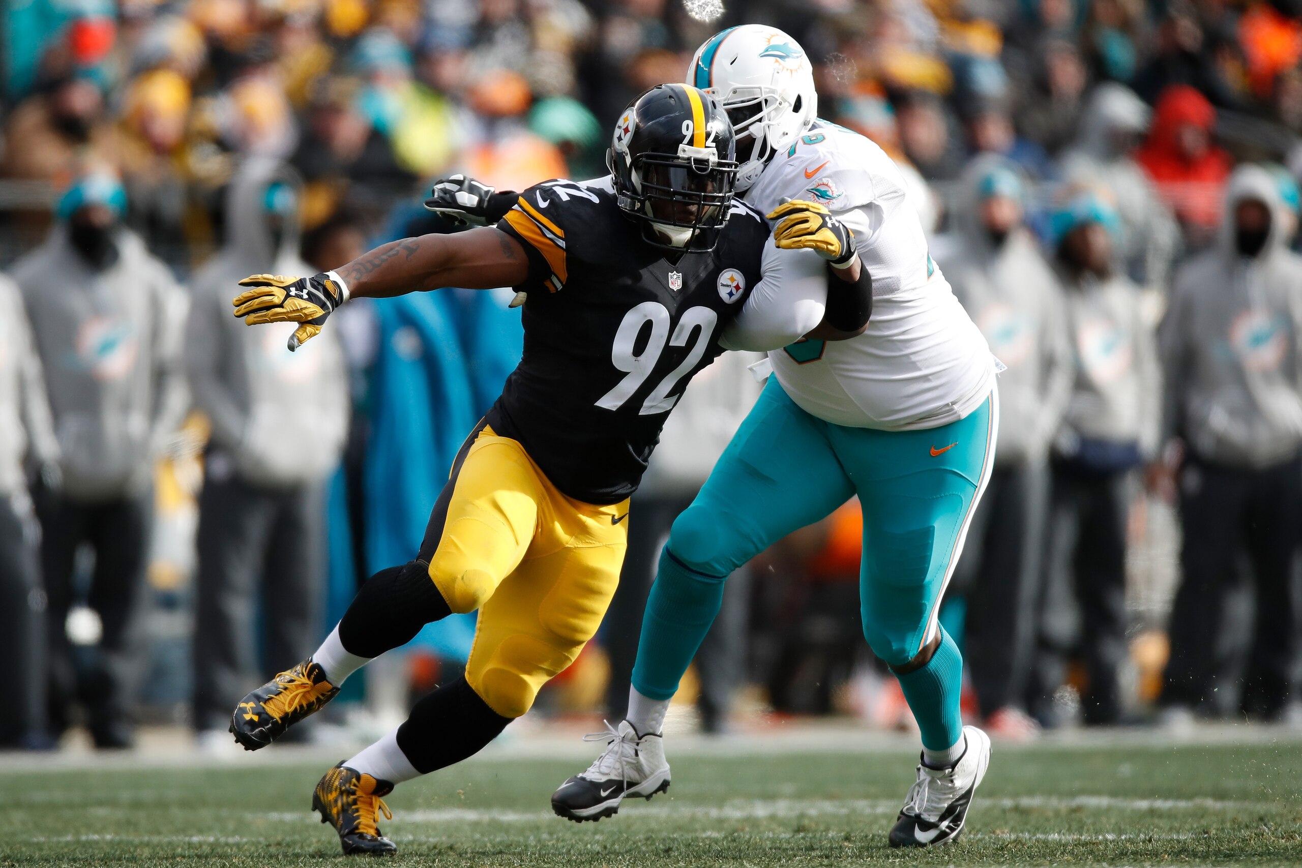 PITTSBURGH, PA - JANUARY 08: James Harrison #92 of the Pittsburgh Steelers pressures quarterback Matt Moore #8 of the Miami Dolphins during the second quarter in the AFC Wild Card game at Heinz Field on January 8, 2017 in Pittsburgh, Pennsylvania. (Phot PITTSBURGH, PA - JANUARY 08: James Harrison #92 of the Pittsburgh Steelers pressures quarterback Matt Moore #8 of the Miami Dolphins during the second quarter in the AFC Wild Card game at Heinz Field on January 8, 2017 in Pittsburgh, Pennsylvania. (Phot