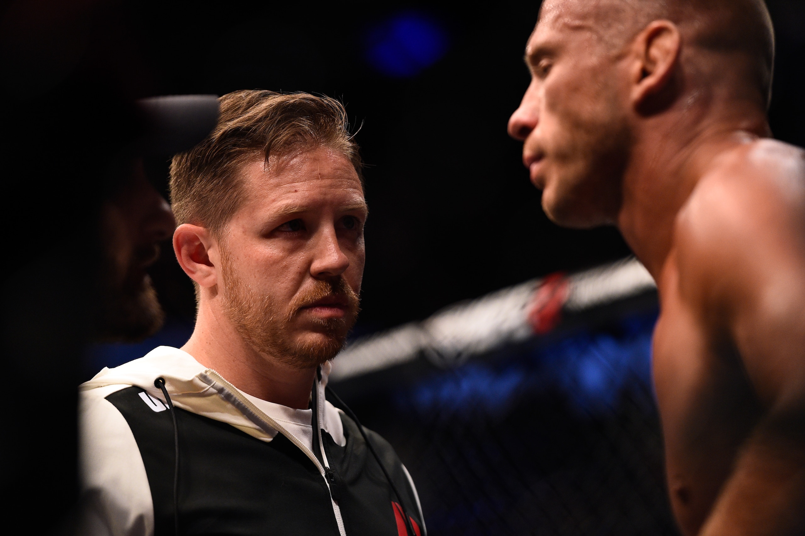 LAS VEGAS, NV - AUGUST 20:  Striking coach Brandon Gibson (L) interacts with Donald Cerrone between rounds against Rick Story in their welterweight bout during the UFC 202 event at T-Mobile Arena on August 20, 2016 in Las Vegas, Nevada. (Photo by Jeff Bot