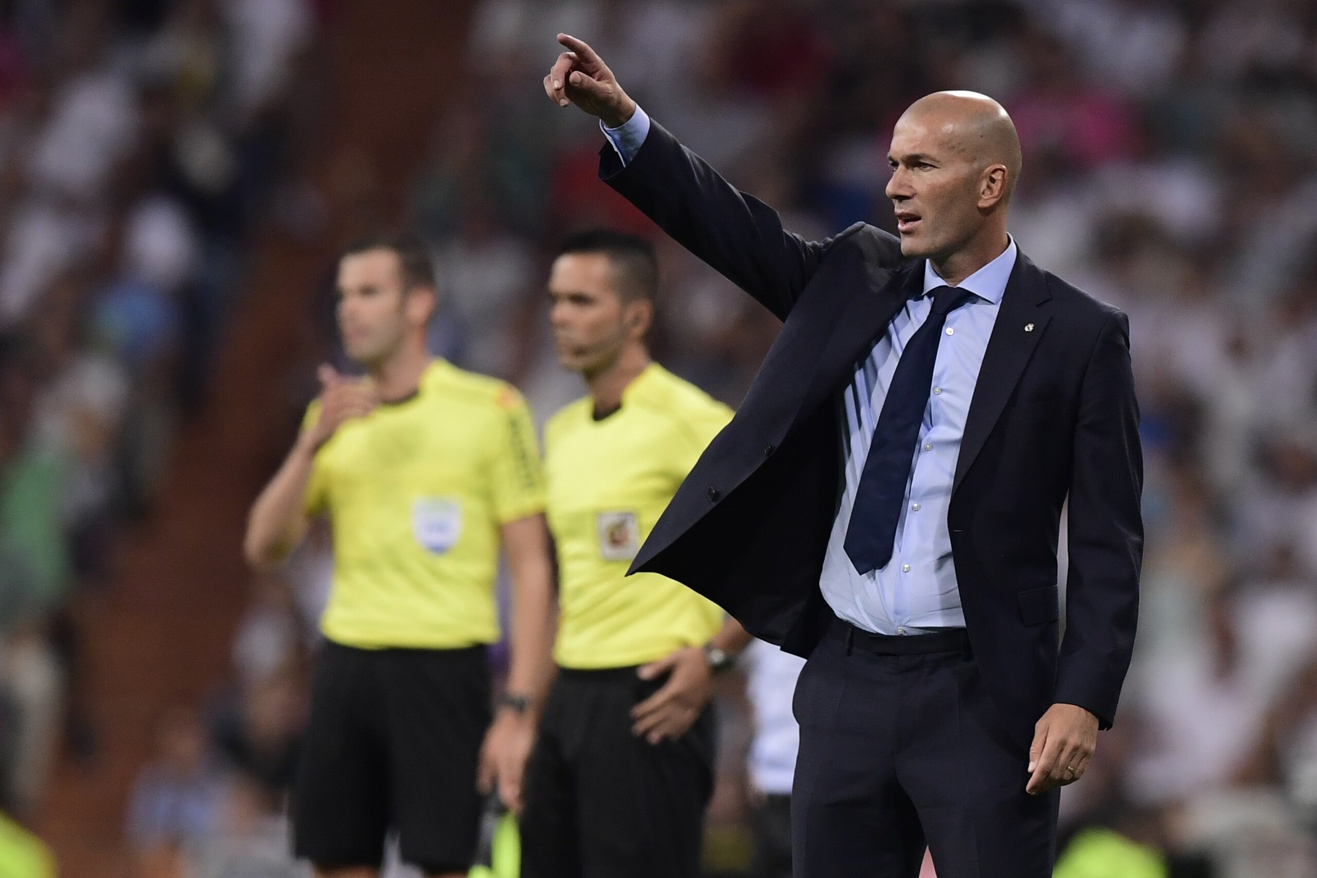 Real Madrid's French coach Zinedine Zidane gestures on the sideline during the second leg of the Spanish Supercup football match Real Madrid vs FC Barcelona at the Santiago Bernabeu stadium in Madrid, on August 16, 2017. / AFP PHOTO / JAVIER SORIANO      