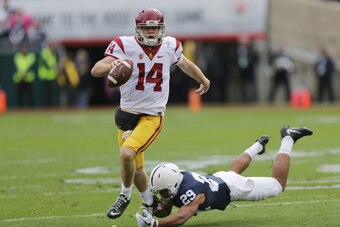 PASADENA, CA - JANUARY 02:  Quarter back Sam Darnold #14 of the USC Trojans avoids the tackle against Cornerback John Reid #29 of the Penn State Nittany Lions in the 2017 Rose Bowl Game presented by Northwestern Mutual at Rose Bowl on January 2, 2017 in P