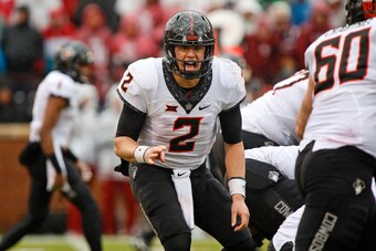 NORMAN, OK - DECEMBER 3: Quarterback Mason Rudolph #2 of the Oklahoma State Cowboys calls a play at the line against the Oklahoma Sooners December 3, 2016 at Gaylord Family-Oklahoma Memorial Stadium in Norman, Oklahoma. Oklahoma defeated Oklahoma State 38