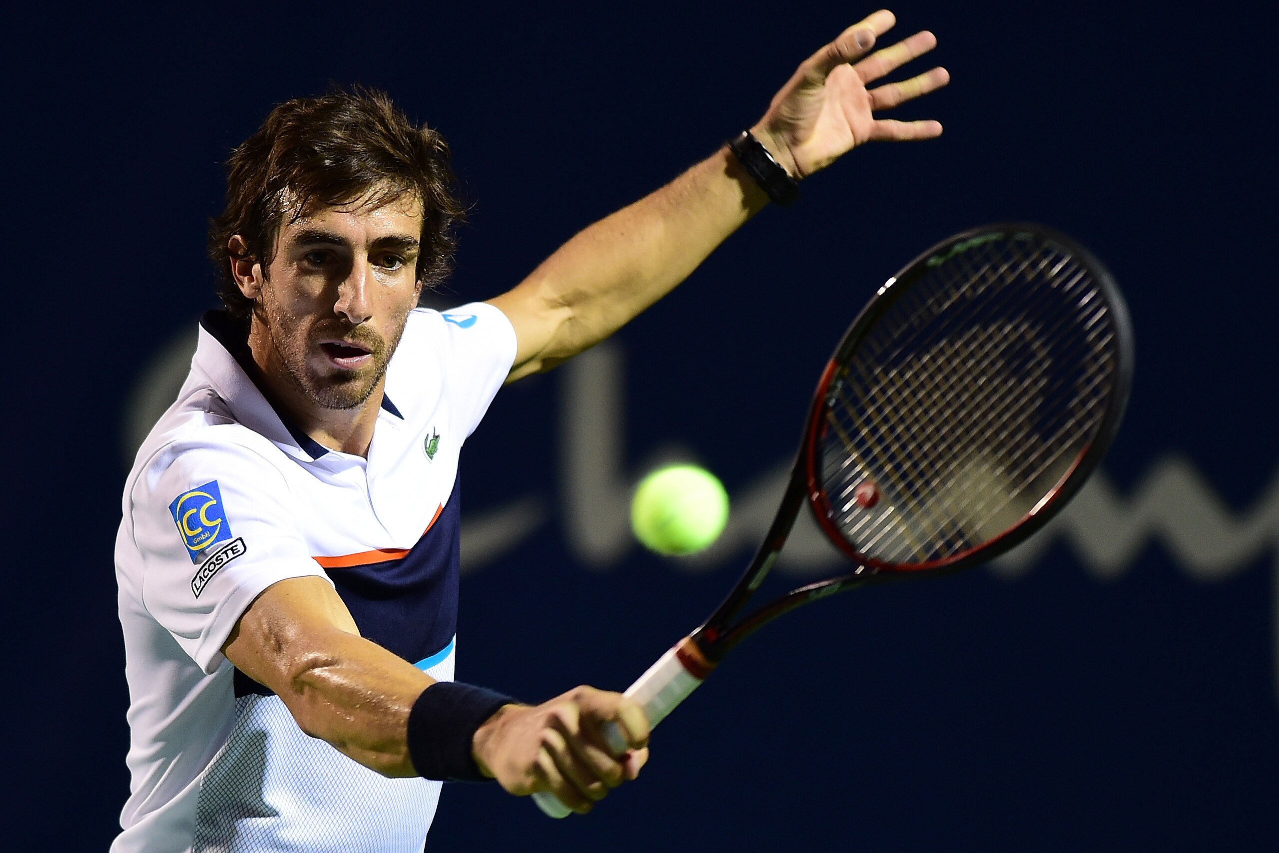WINSTON SALEM, NC - AUGUST 21:  Pablo Cuevas of Uruguay returns a shot from Jan-Lennard Struff of Germany during the third day of the Winston-Salem Open at Wake Forest University on August 21, 2017 in Winston Salem, North Carolina.  (Photo by Jared C. Til