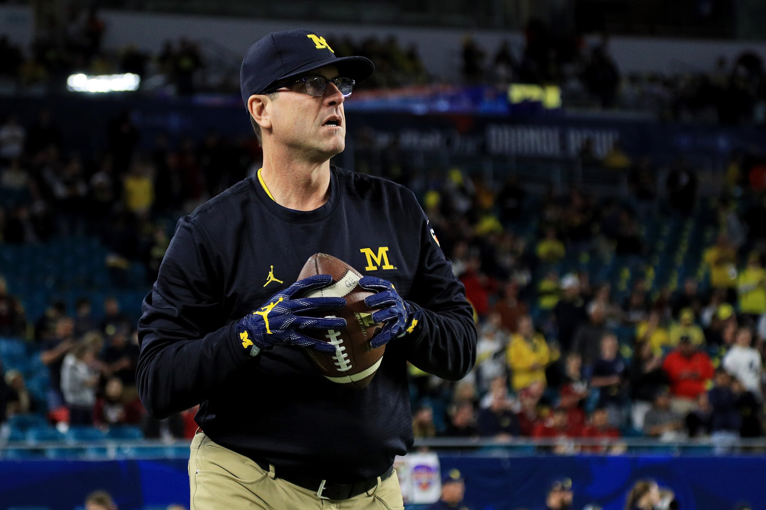 MIAMI GARDENS, FL - DECEMBER 30:  Head coach Jim Harbaugh of the Michigan Wolverines looks on prior to their Capitol One Orange Bowl game against the Florida State Seminoles at Sun Life Stadium on December 30, 2016 in Miami Gardens, Florida.  (Photo by Mi