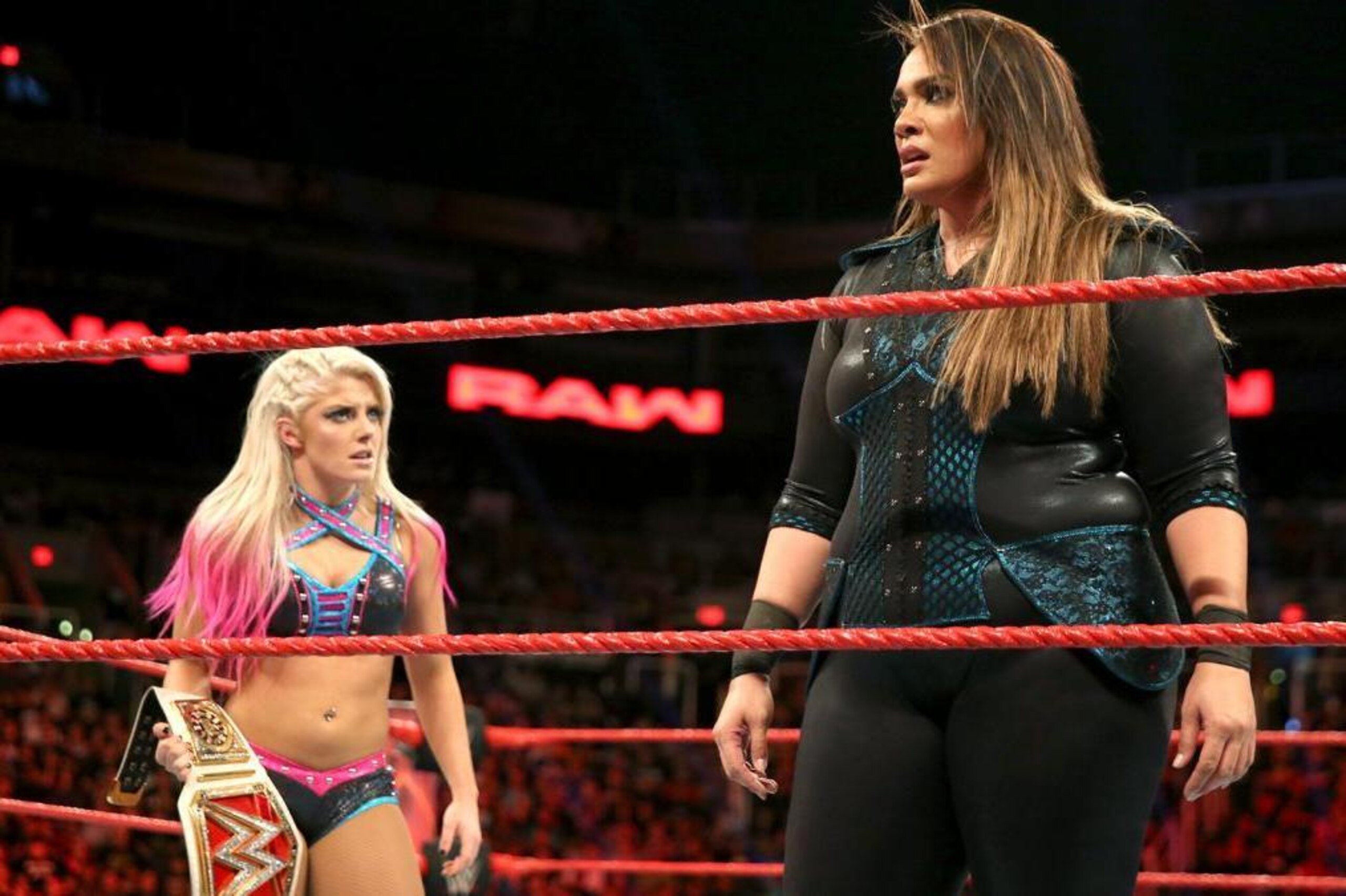 Alexa Bliss and Nia Jax share a tense moment after tag team match.