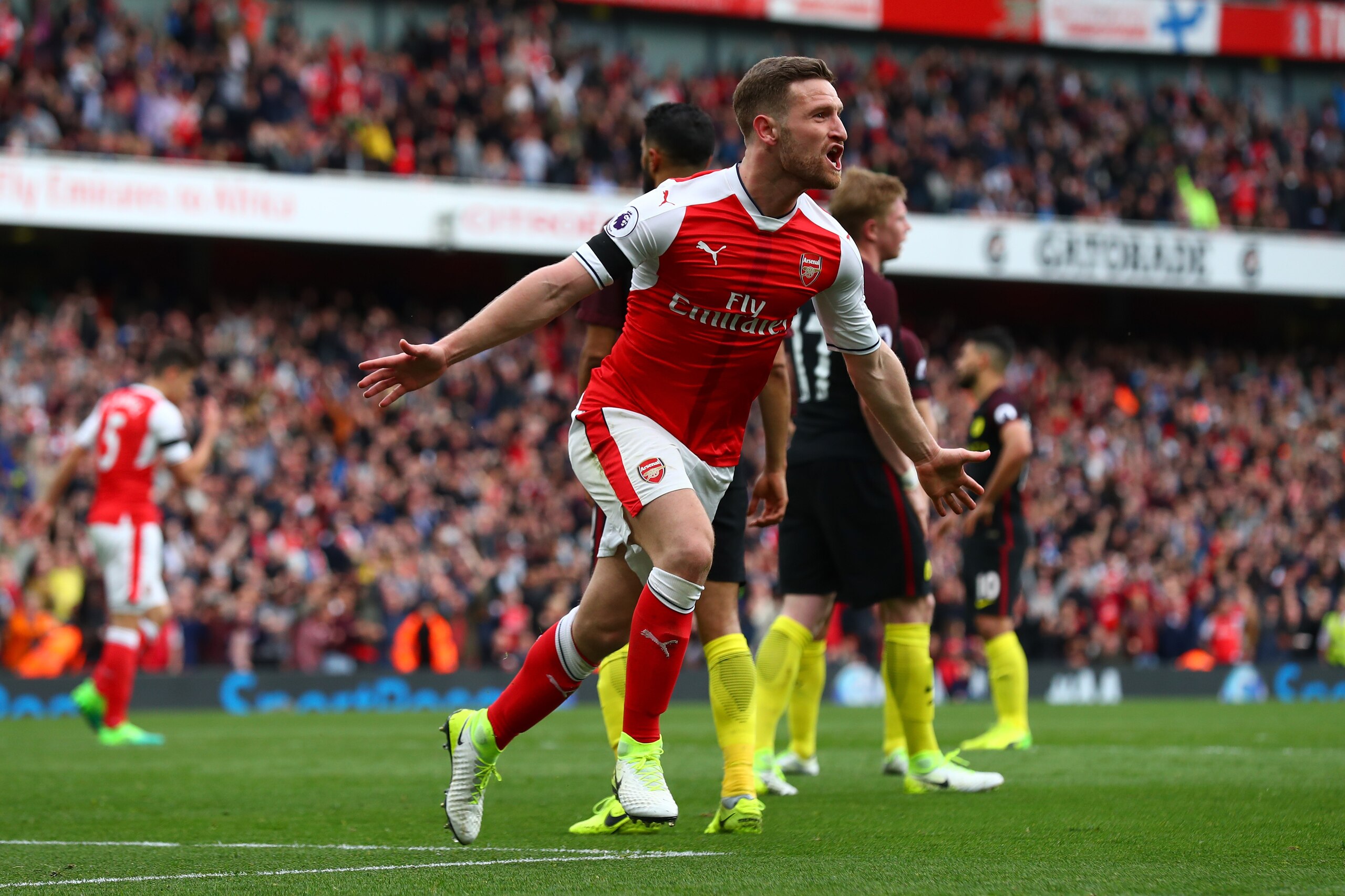 LONDON, ENGLAND - APRIL 02:  Shkodran Mustafi of Arsenal celebrates scoring his sides second goal during the Premier League match between Arsenal and Manchester City at Emirates Stadium on April 2, 2017 in London, England.  (Photo by Clive Rose/Getty Imag