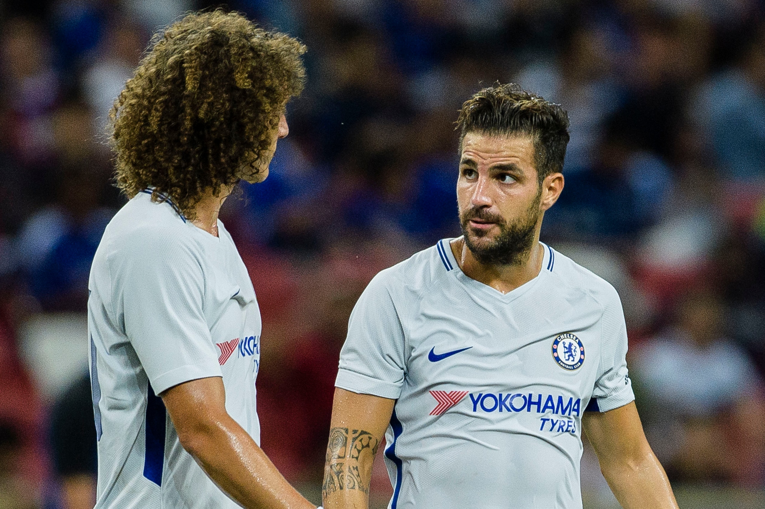 SINGAPORE, SINGAPORE - JULY 29: Chelsea Midfielder Cesc Fabregas (R) speaks to teammate David Luiz during the International Champions Cup 2017 match between FC Internazionale and Chelsea FC on July 29, 2017 in Singapore. (Photo by Power Sport Images/Getty