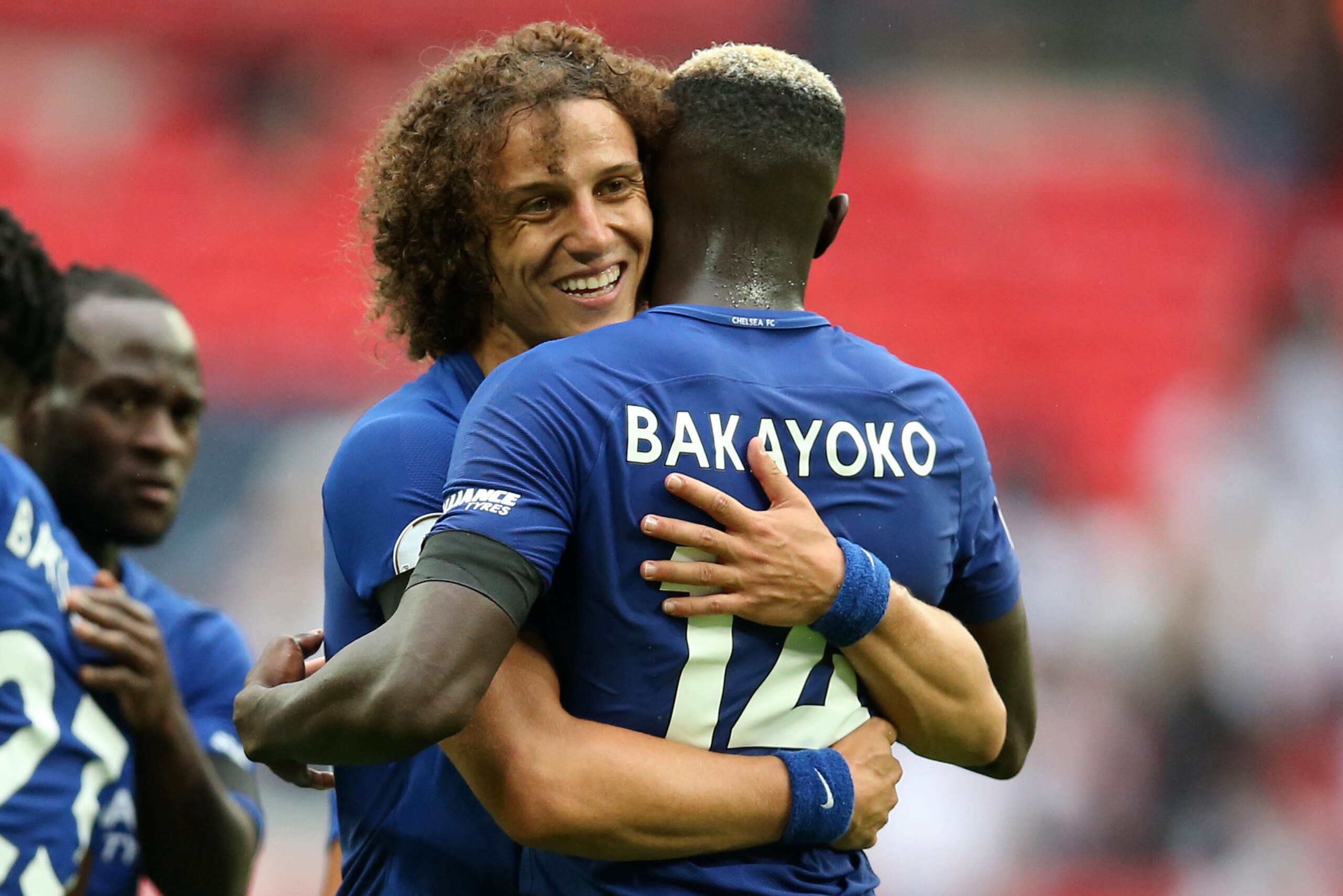 LONDON, ENGLAND - AUGUST 20: David Luiz of Chelsea hugs Tiemoue Bakayoko of Chelsea during the Premier League match between Tottenham Hotspur and Chelsea at Wembley Stadium on August 20, 2017 in London, England. (Photo by Catherine Ivill - AMA/Getty Image